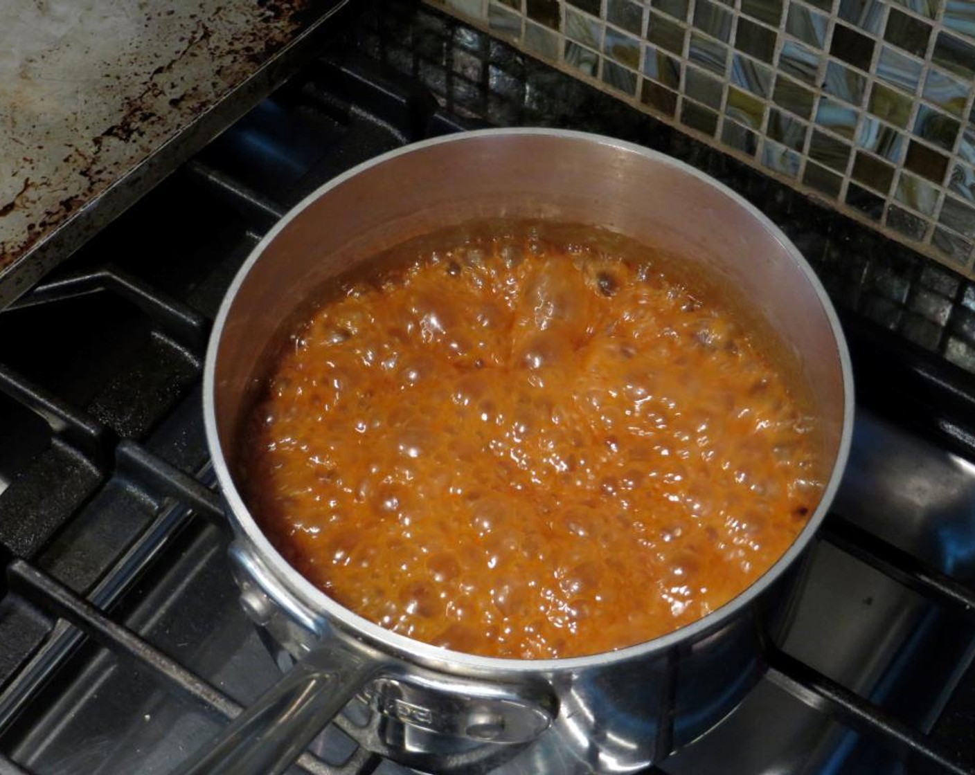 step 7 When it achieves a deep brown (not burnt) color, pour the Heavy Cream (3/4 cup) into the center of the pan. It will steam and bubble vigorously -- that's ok.