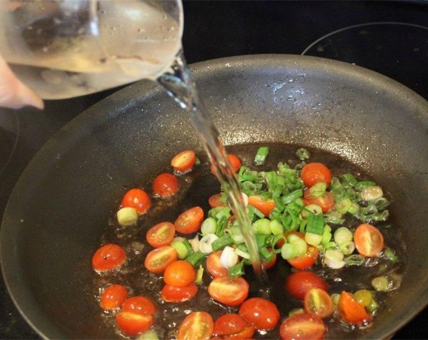 step 8 In the hot pan, add the scallion, tomatoes, and White Wine (1 cup).