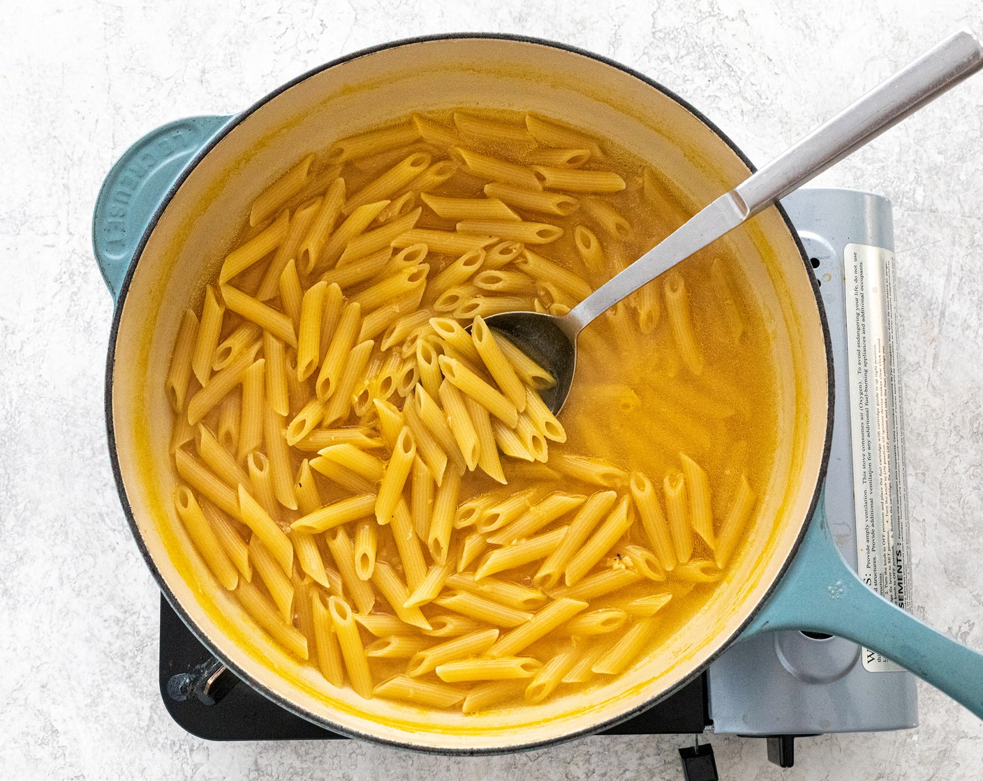 step 5 Add Penne Pasta (8 oz) and Vegetable Stock (4 cups) to the pot. Bring the liquid to a boil over high heat. Cook and frequently stir until the pasta is tender, and only a small amount of the liquid remains to make a light sauce, about 15 to 17 minutes. Turn off the heat.