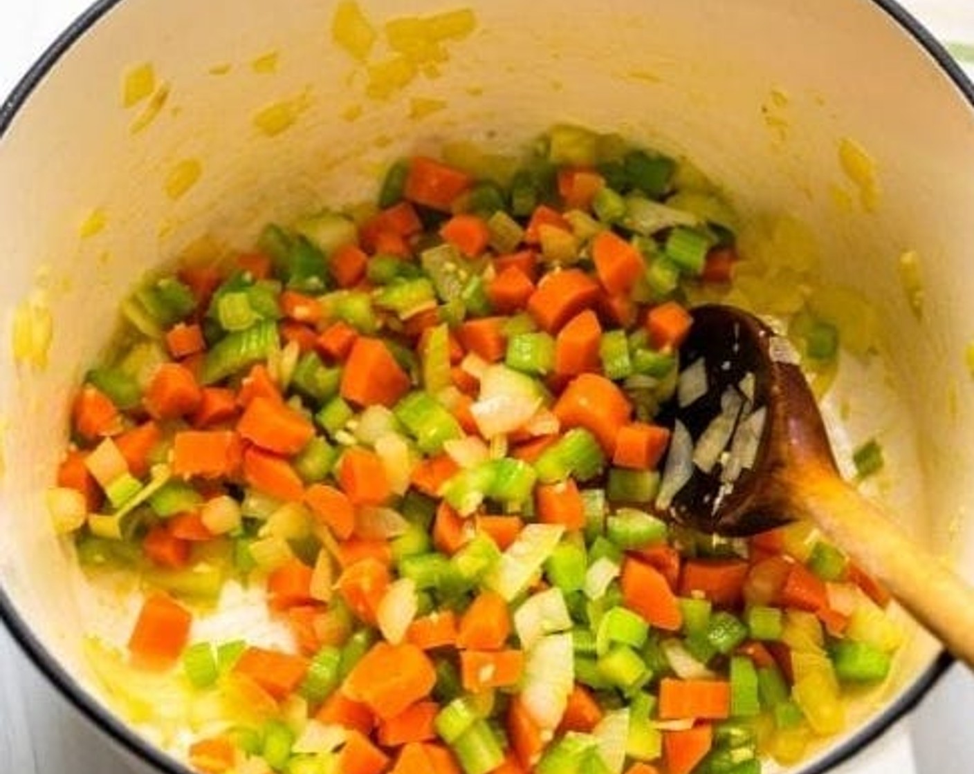 step 1 In a large pot or Dutch Oven, heat the Olive Oil (2 Tbsp) over medium-high heat. Add the Yellow Onion (1), Carrots (4), and Celery (3 stalks) and sauté until the vegetables are tender and the celery and onions are slightly translucent.