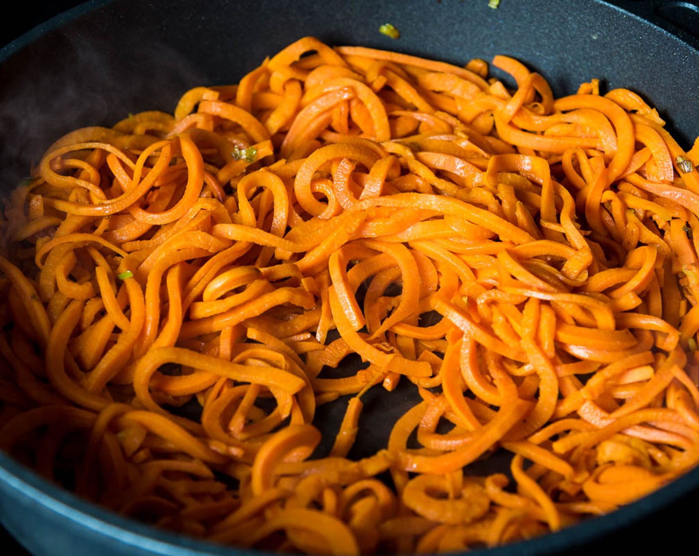 step 6 Heat Olive Oil (1/4 cup) a large nonstick skillet until warm. Add Scallion (1 bunch). Stir a few times to release the fragrance. Add sweet potato and Sea Salt (1 pinch). Cook and stir until soft. Transfer to a serving plate.