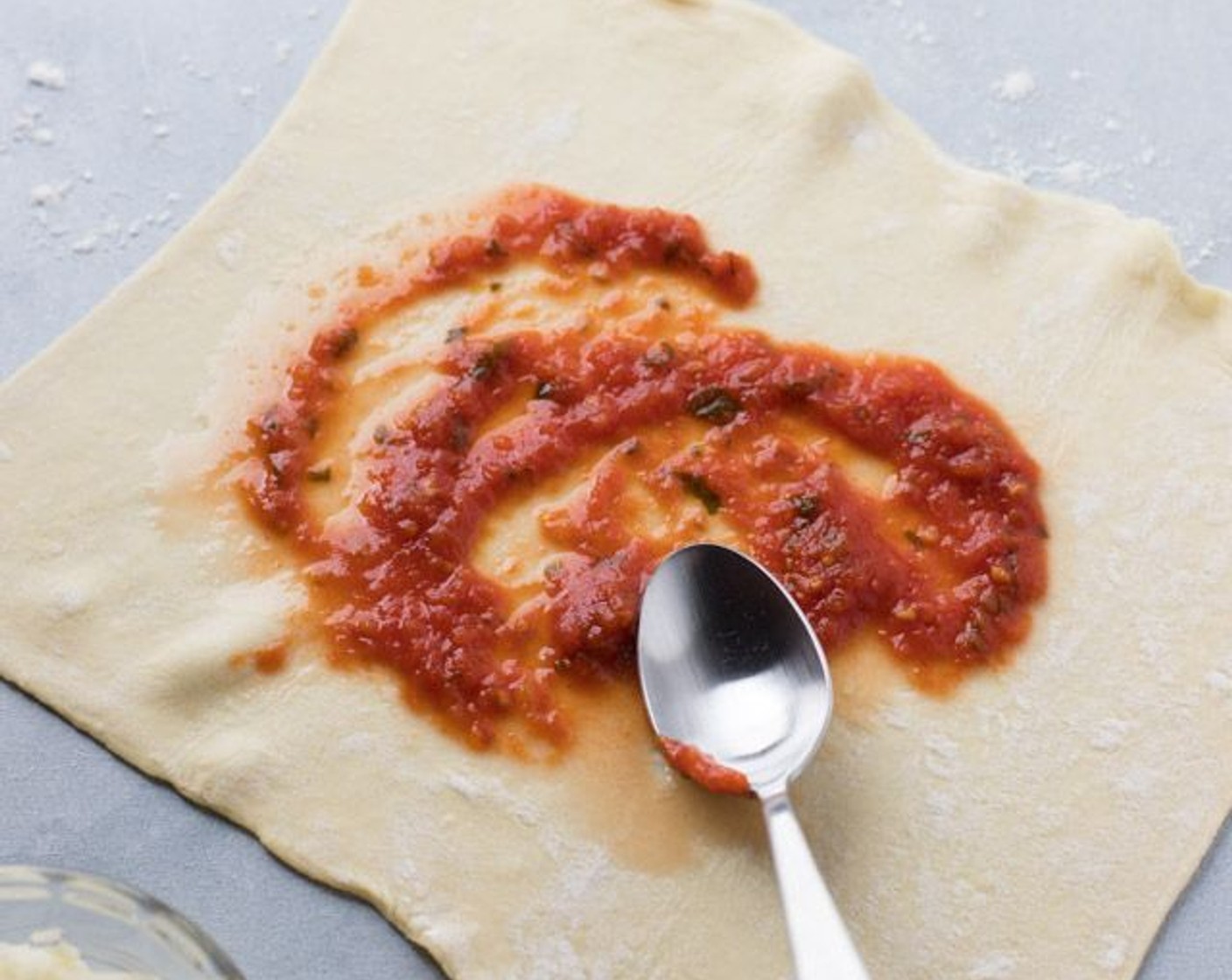 step 2 Spread Pizza Sauce (1/4 cup) evenly on both halves.