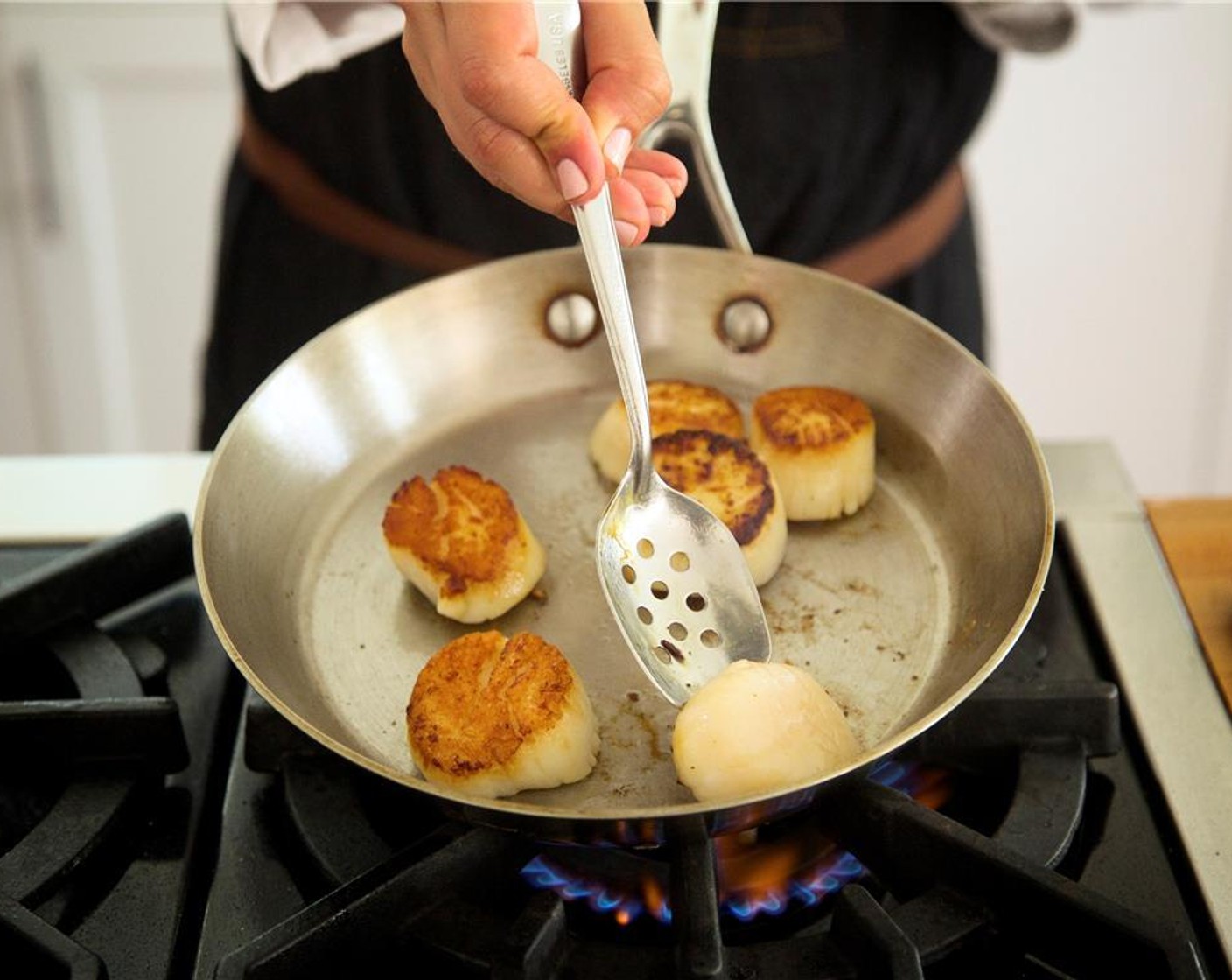 step 17 Turn scallops over and cook one minute on the second side. Remove from heat and hold for plating.