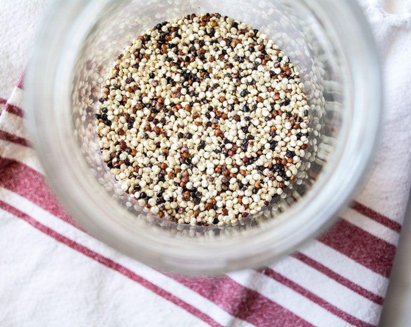 step 2 Thoroughly rinse the Quinoa (1/4 cup) to remove the saponin by adding uncooked quinoa to a bowl, filling it with clean water and soaking for a few minutes. Use a wire whisk to move the quinoa around in the water, then strain the quinoa in a fine-mesh sieve and rinse with fresh water.