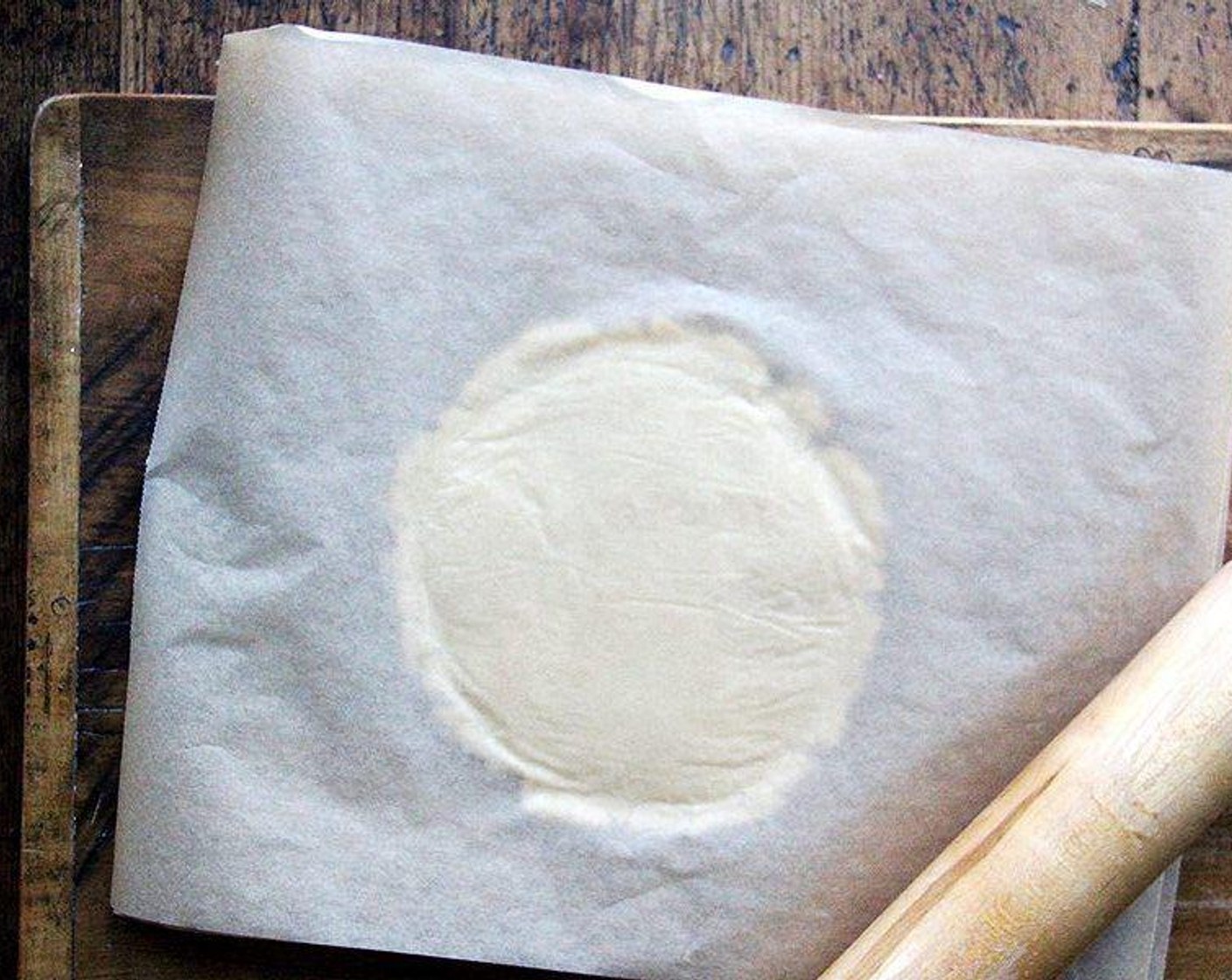 step 6 Roll out our dough on a lightly floured surface or in between parchment paper to 1/2-inch thick.