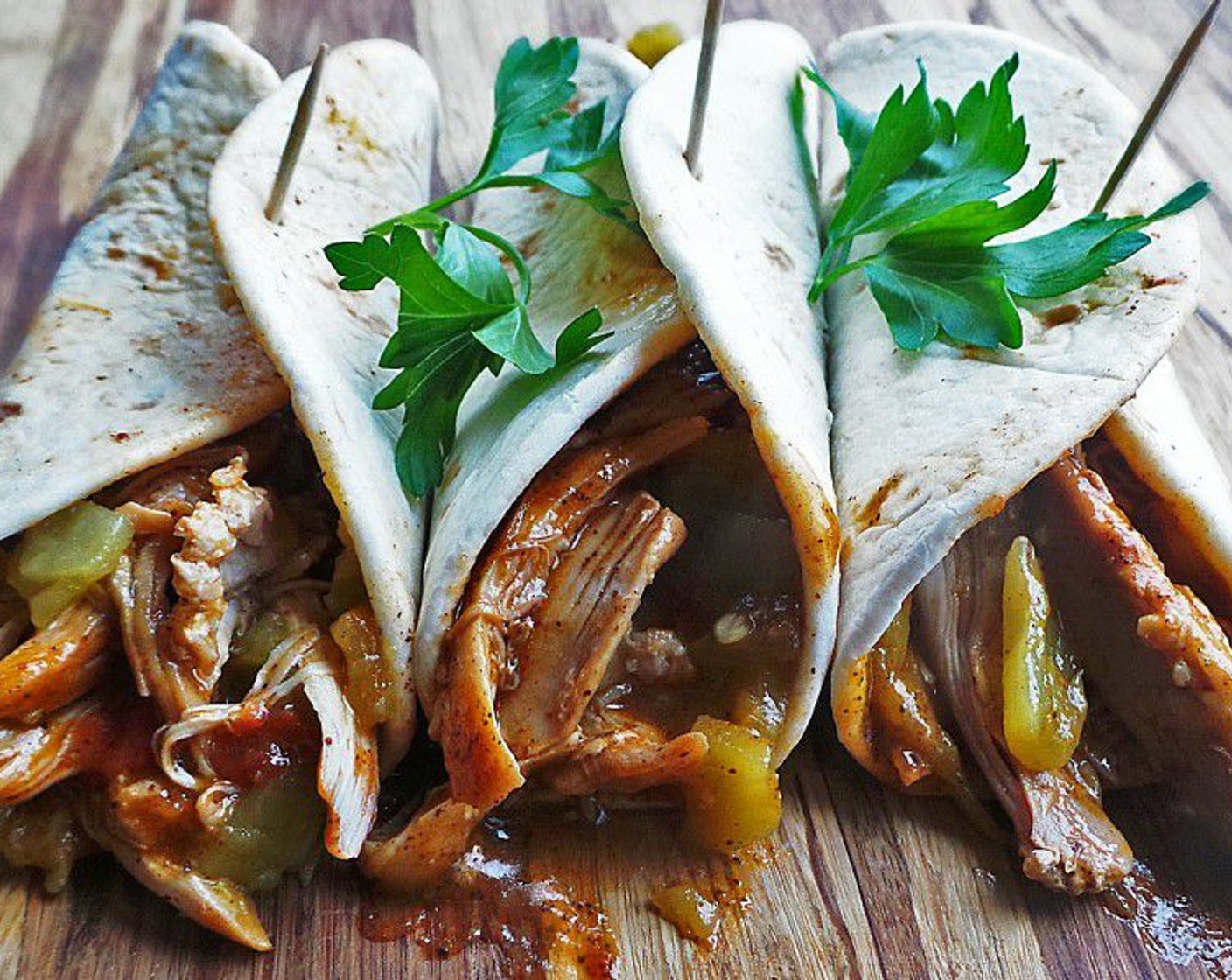 step 7 Stuff into White Corn Tortillas (6) and top with Mild Diced Green Chiles (1 can) and Fresh Cilantro (to taste). Enjoy!