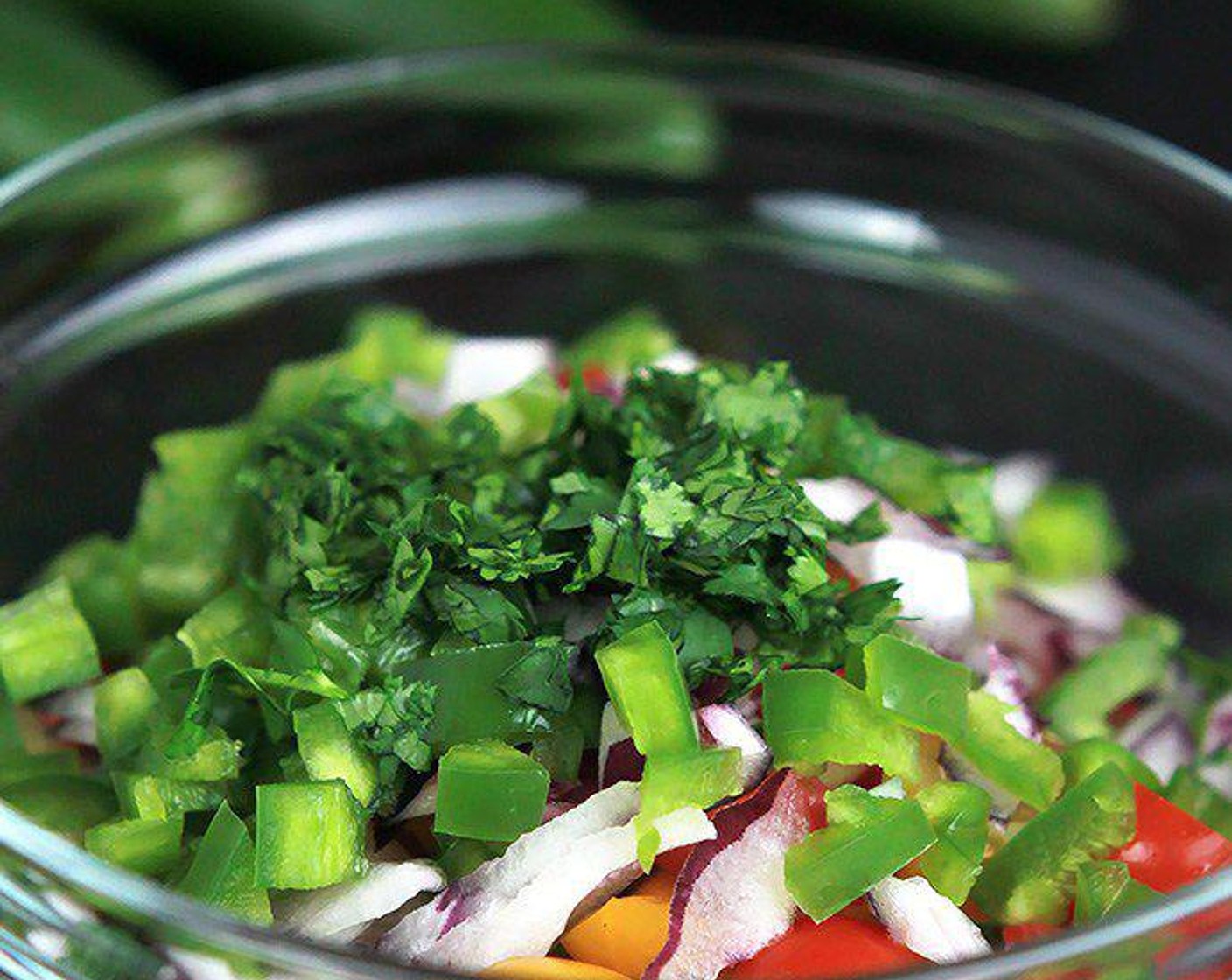 step 2 While protein is absorbing the water, mix together the Cherry Tomato (1 cup), Jalapeño Peppers (3 Tbsp), Red Onions (3 Tbsp), and Fresh Cilantro (1 Tbsp). Season with Salt (to taste) and Ground Black Pepper (to taste), cover, and set aside.