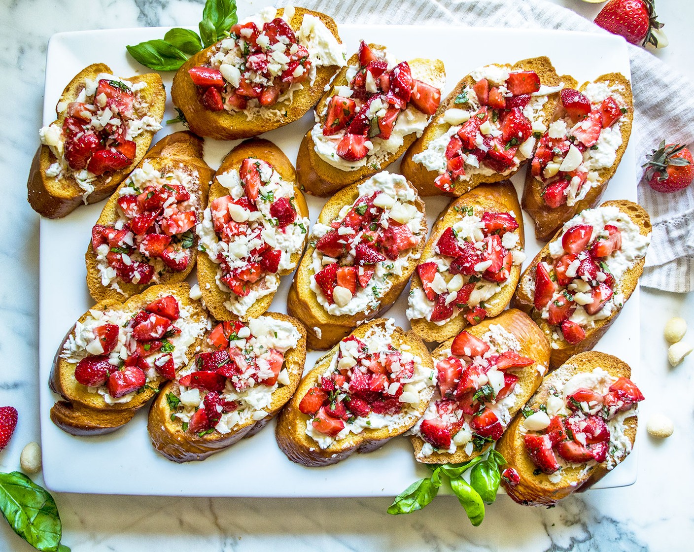 step 8 Using the remaining olive oil and balsamic reduction mixture left from the strawberries, carefully drizzle a small spoonful over each bruschetta slice. Serve fresh and enjoy!