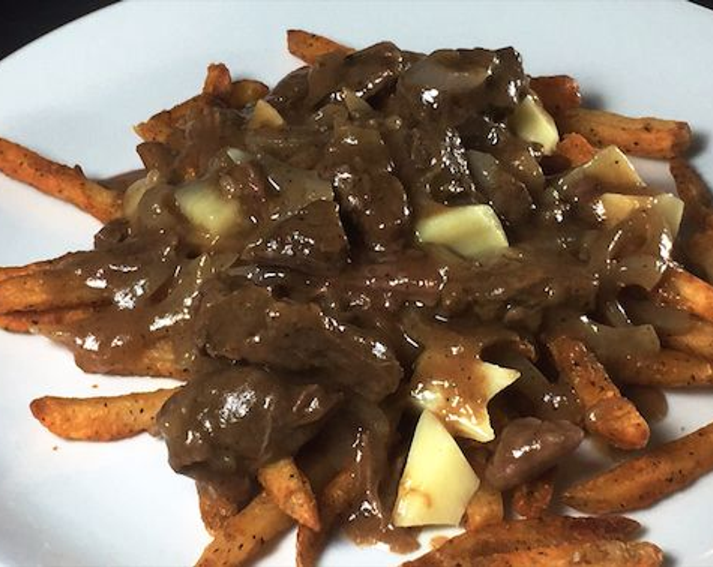 step 7 Serve over French Fries (to taste) with White Cheddar Cheese Curds (to taste).