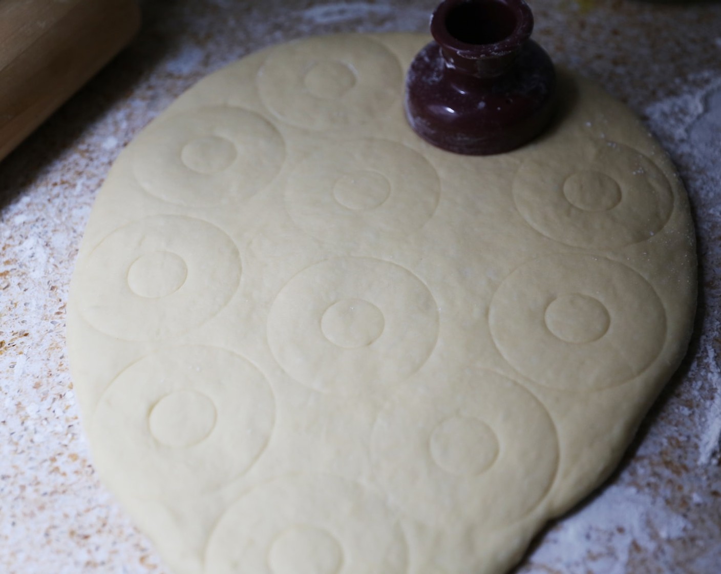 step 12 Using a floured doughnut cutter, begin cutting out your doughnuts.