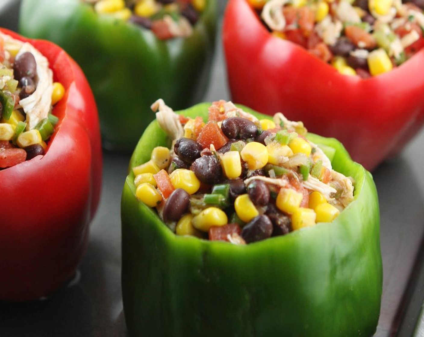 step 5 Divide the mixture between the hollowed-out peppers. Place in the prepared baking dish.