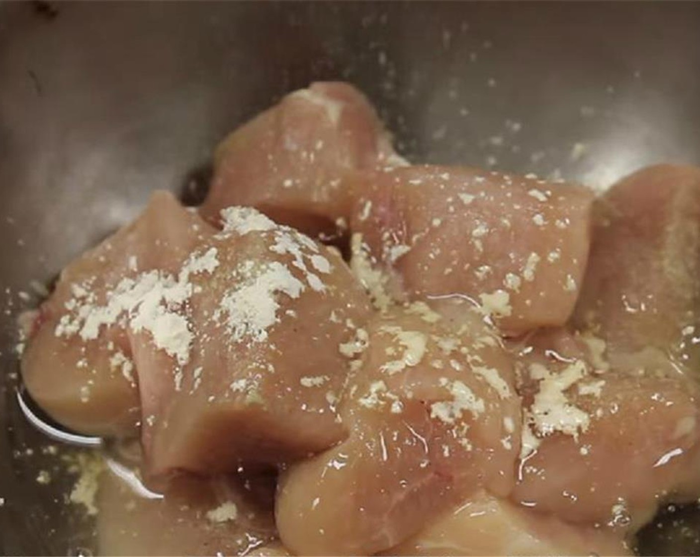 step 3 In a bowl, add the chicken, Salt (1/2 tsp), Ground White Pepper (1 dash), McCormick® Garlic Powder (1/8 tsp), white part of the Egg (1) and Rice Wine (2 Tbsp). Mix the marinade with the chicken and refrigerate for 30 minutes.