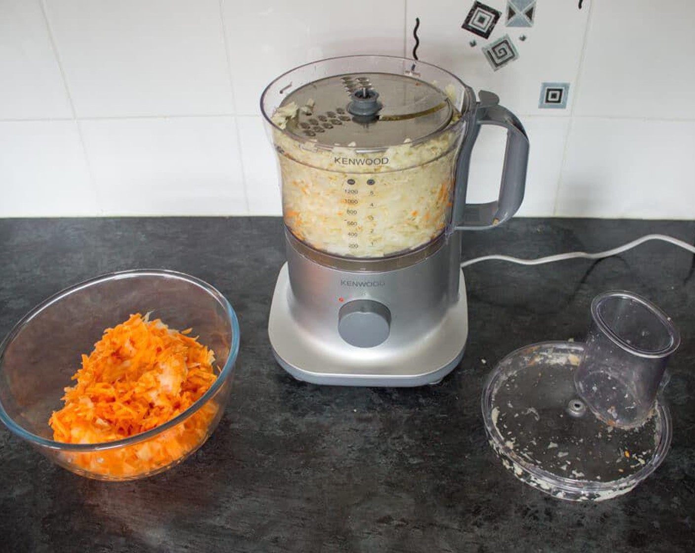 step 2 Using the grater attachment/disc in your food processor, push through all the vegetables and blitz until they’re grated. You may need to do this in a couple of batches as this will make a surprising amount.