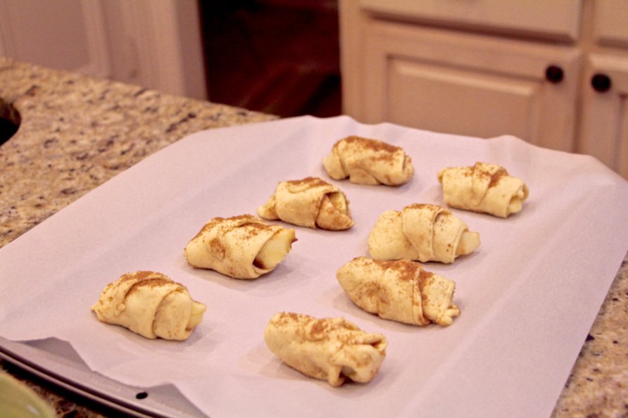 Step 8 of Apple Pie Bites Recipe: Brush the top with remaining tablespoon of Butter (1 tablespoon) , then sprinkle the top with remaining sugar mixture.