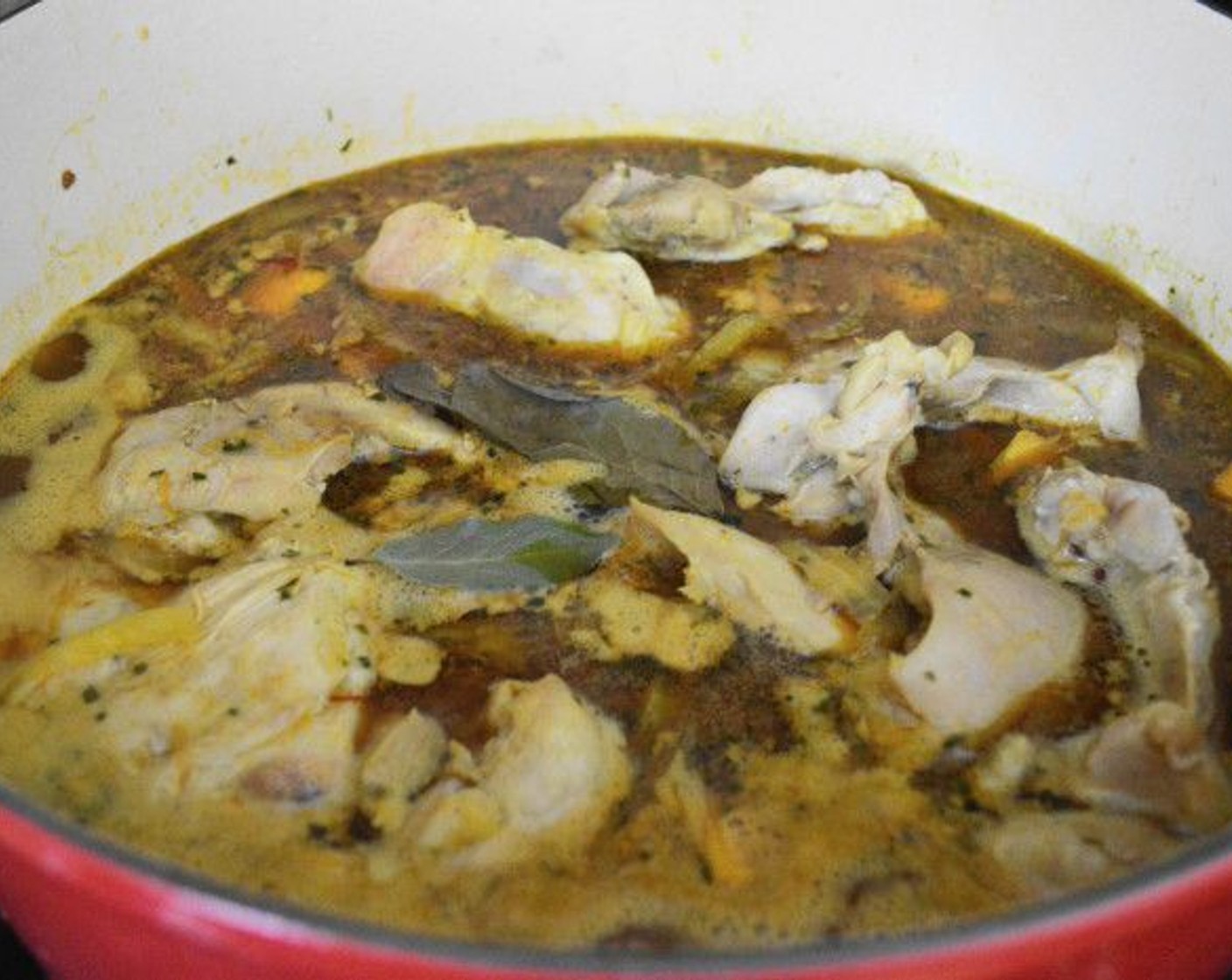 step 6 Return the chicken to the pot and stir everything well. Add the Bay Leaves (2) in last. Bring the pot to a boil again and reduce it to a simmer. Let the chicken simmer for 2 hours.