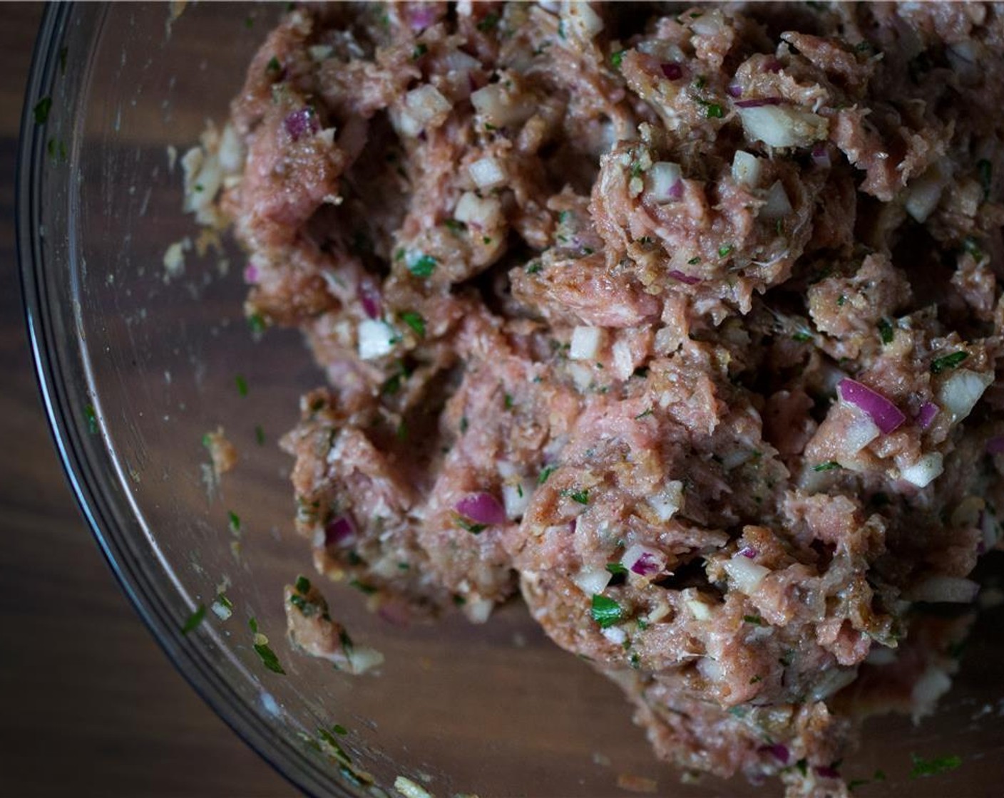 step 2 In a large bowl, mix all ingredients for the meatballs Ground Lamb (1.5 lb), Bulgur Wheat (2 Tbsp), Garlic (2 cloves), Red Onion (1), Kosher Salt (1 tsp), Ground Black Pepper (1/2 tsp), {@10:}, Ground Cumin (1 1/4 tsp), Paprika (1 tsp), Ground Cinnamon (1/2 tsp), Italian Flat-Leaf Parsley (2 Tbsp) until well incorporated – hands work best for this. Cover and refrigerate for 30 minutes and up to 24 hours.