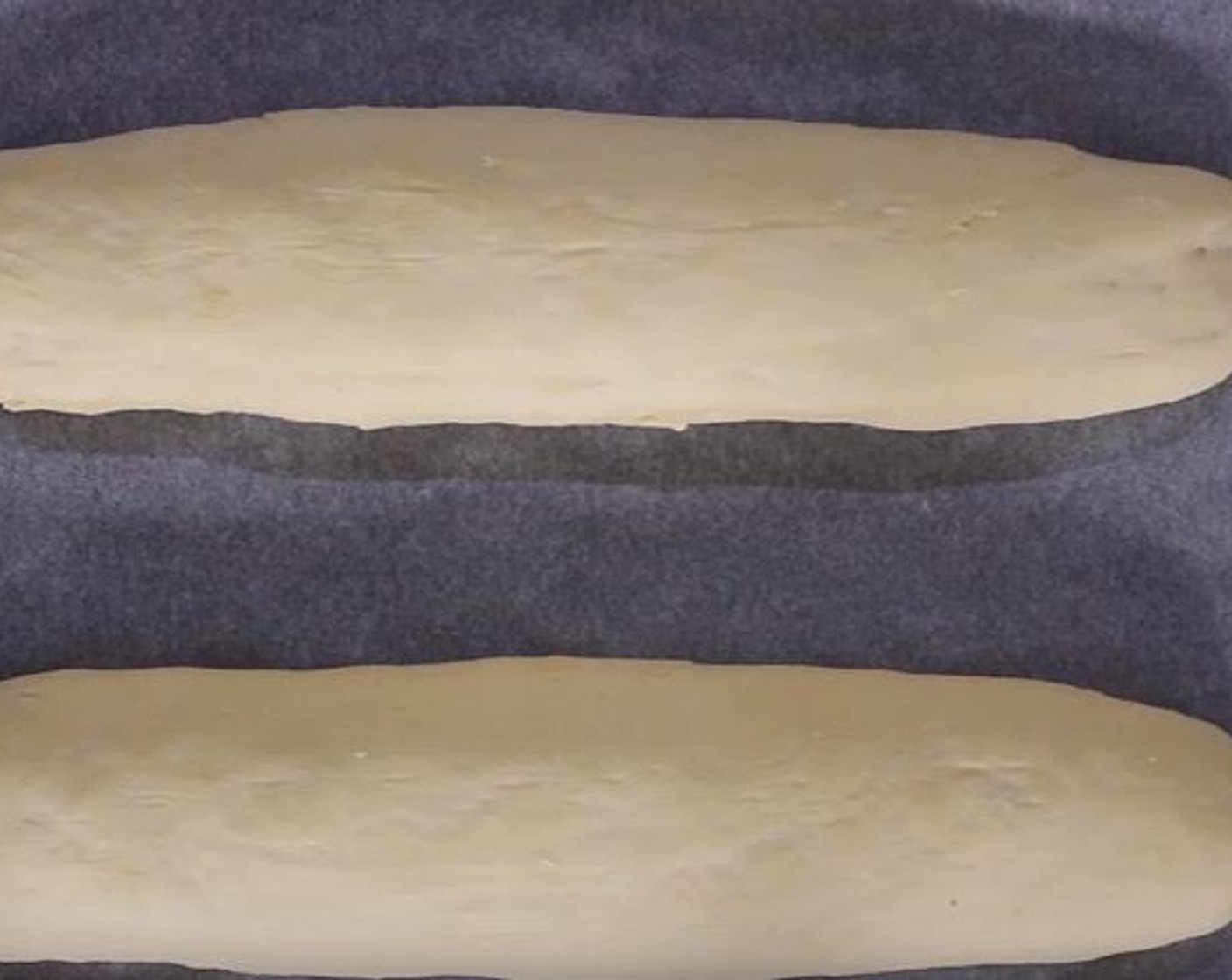 step 7 Transfer the loaves to a tray lined with baking paper. Cover and let rest for 1 hour.