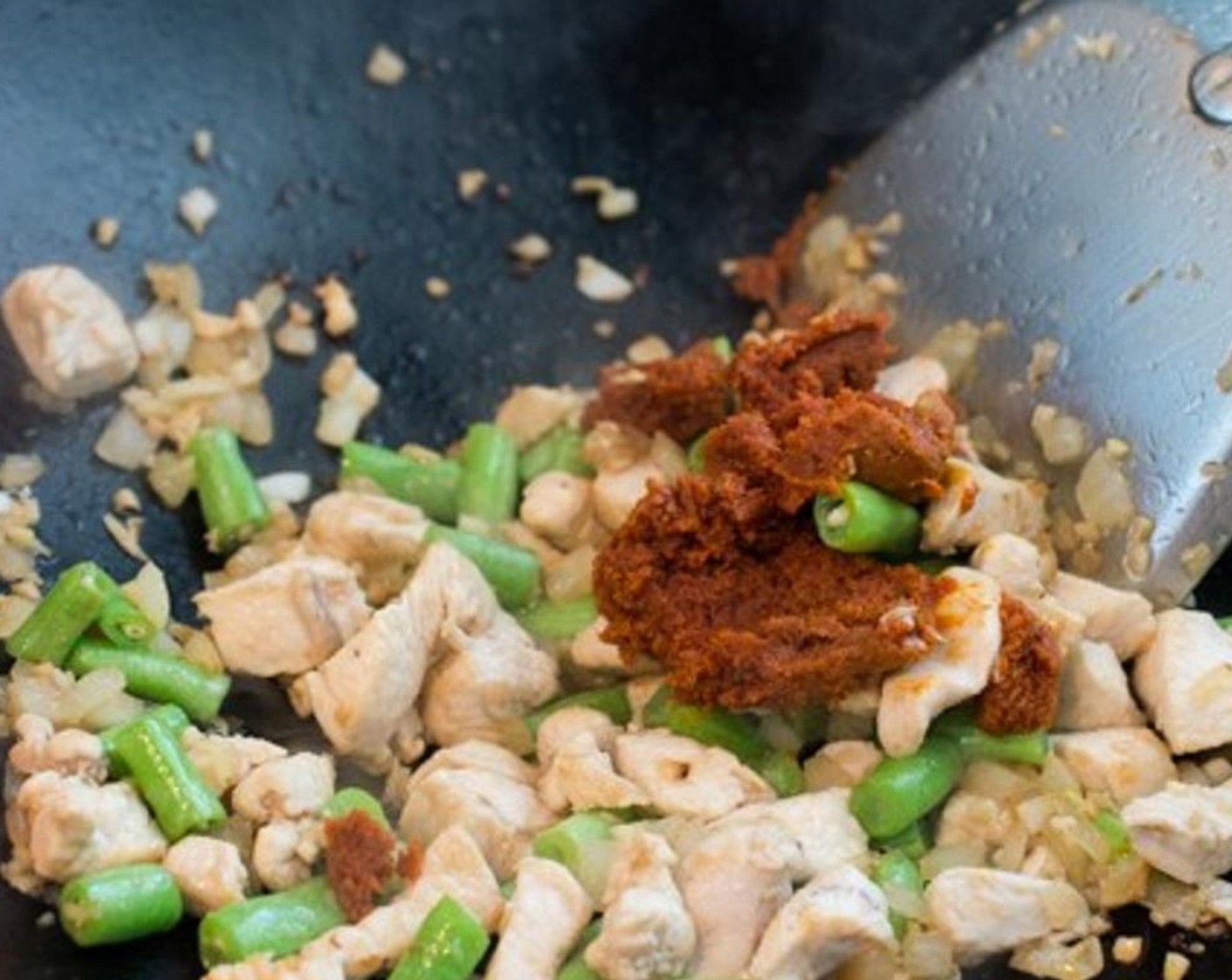 step 8 Add Thai Red Curry Paste (2 Tbsp) and mix well.