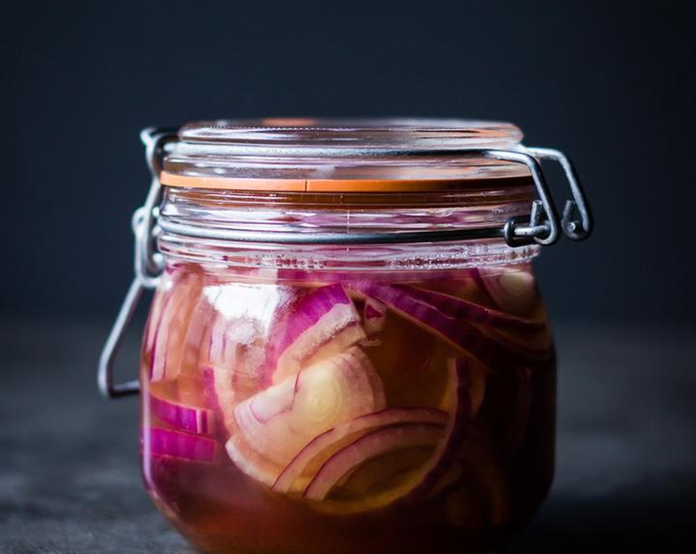 step 3 Add the Distilled White Vinegar (1/2 cup) to the hot water mixture, stir to combine and pour liquid over the red onions in the jar.