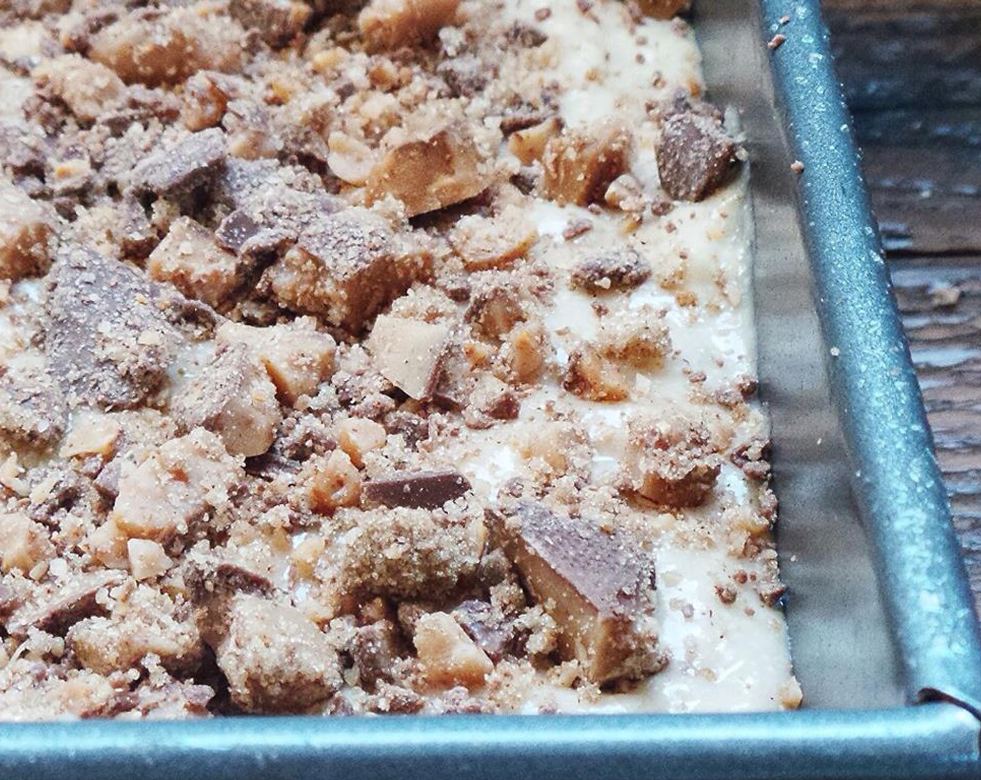 step 6 Prepare the crumble by mixing the crushed Heath Bars (1 1/2 cups), Brown Sugar (2 Tbsp) and Simply Organic Cinnamon, Ground (1 Tbsp). Add half to the batter, mix, and pour into the prepared baking pan.