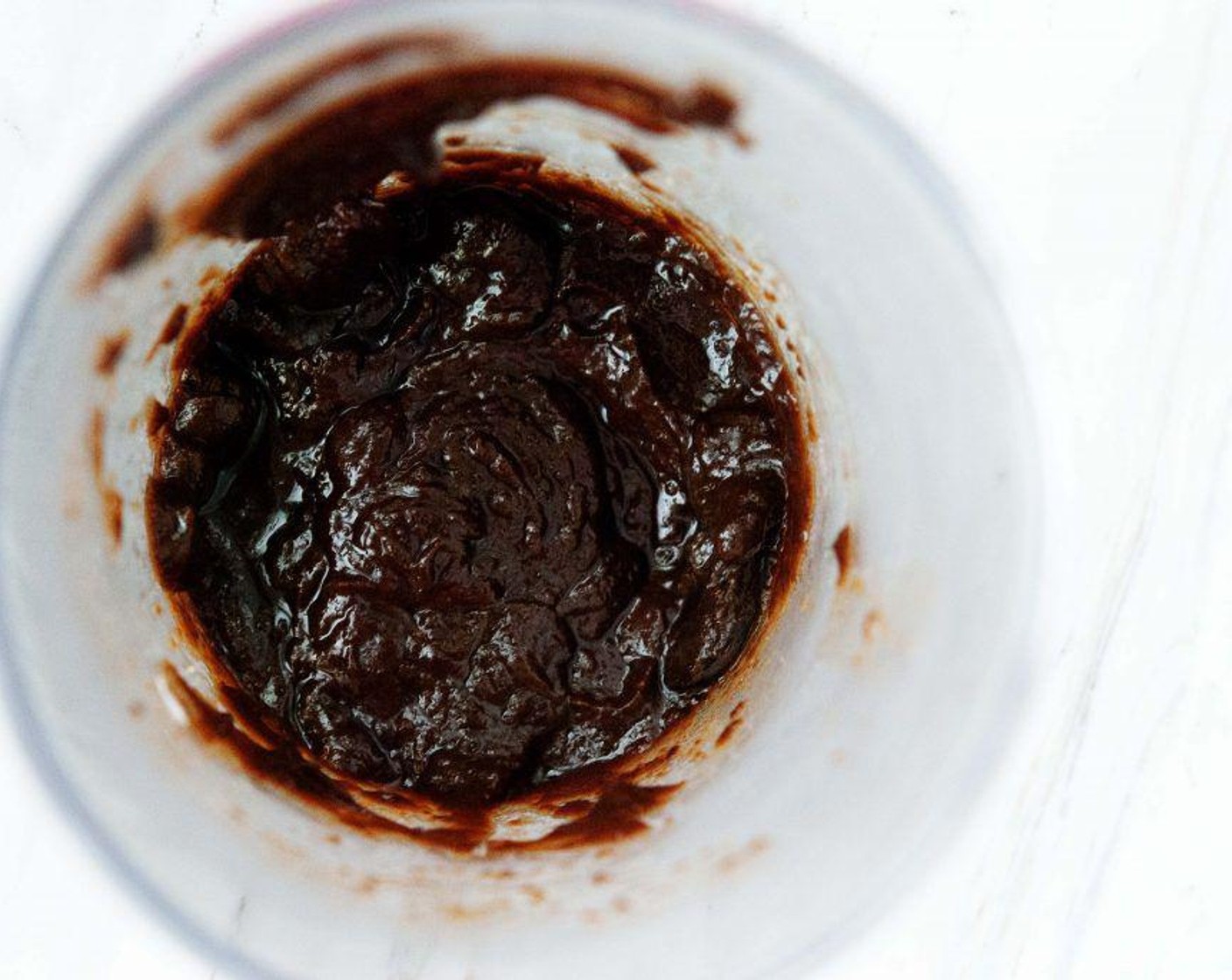 step 4 Add the Black Garlic (3 heads) and some Salt (to taste) and Ground Black Pepper (to taste) to the bowl of pasta water and let stand for 10 minutes. Then use an immersion blender to purée into a sauce.