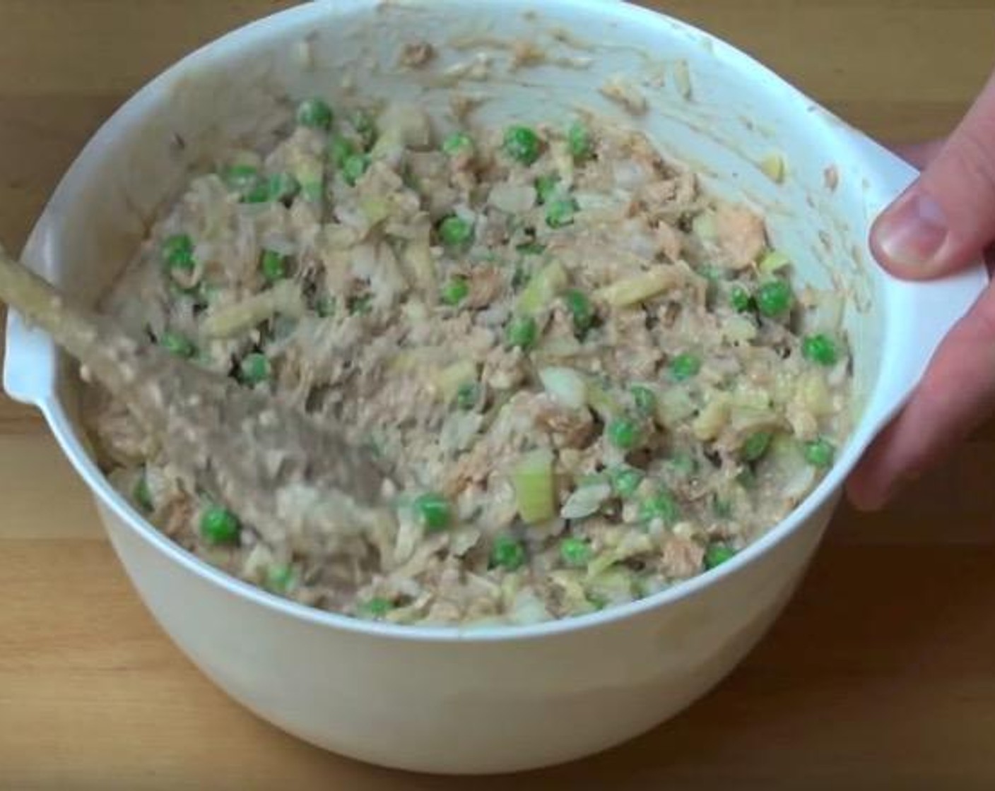 step 1 In a mixing bowl, add the cooked White Rice (2 1/2 Tbsp), Yellow Onion (1), Cheddar Cheese (1/2 cup), Pink Salmon (14 oz), Frozen Green Peas (2 cups) and Cream of Mushroom Soup (14 oz). Mix together.