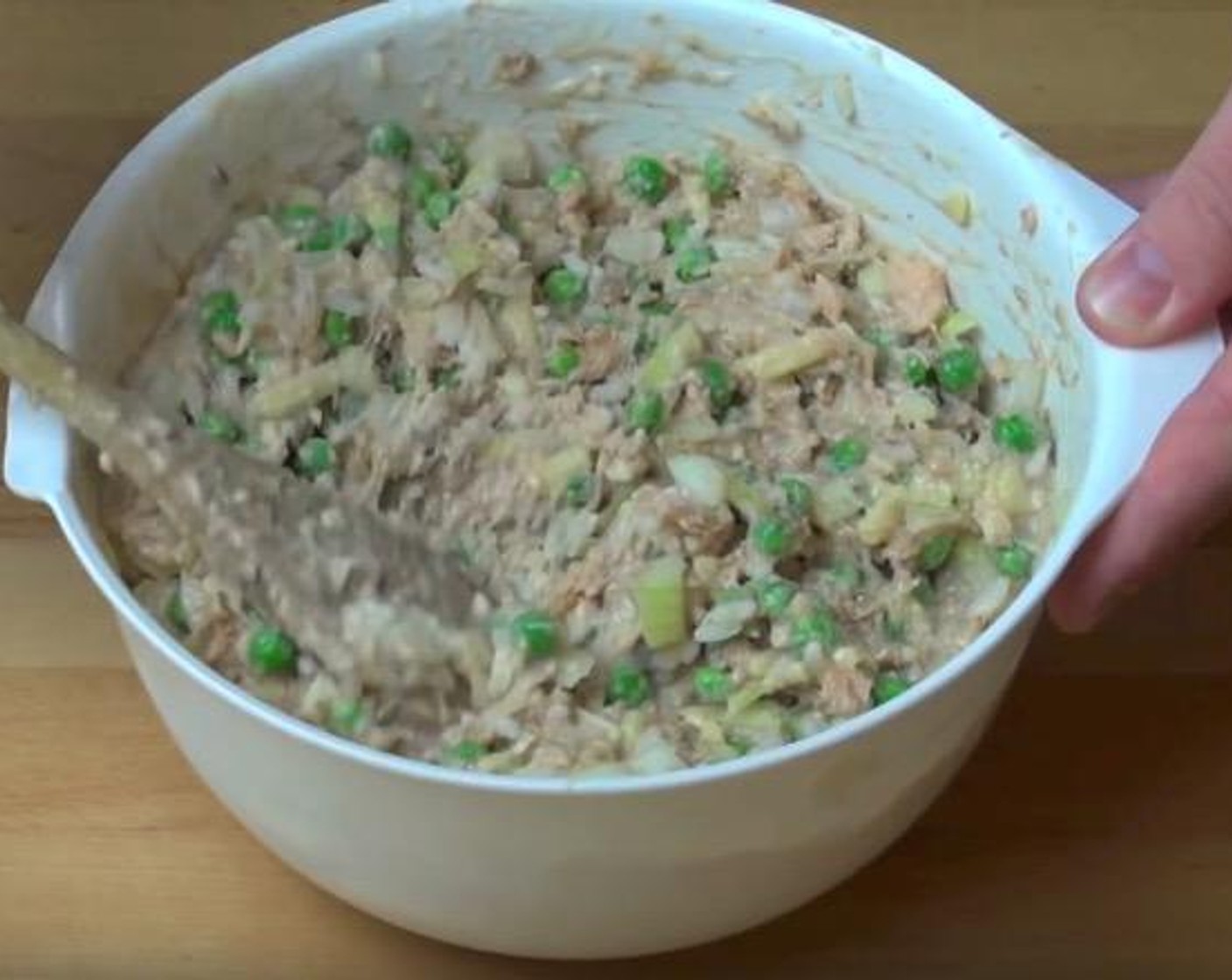 step 1 In a mixing bowl, add the cooked White Rice (2 2/3 Tbsp), Yellow Onion (1), Cheddar Cheese (1/2 cup), Pink Salmon (14 oz), Frozen Green Peas (2 cups) and Cream of Mushroom Soup (14 oz). Mix together.