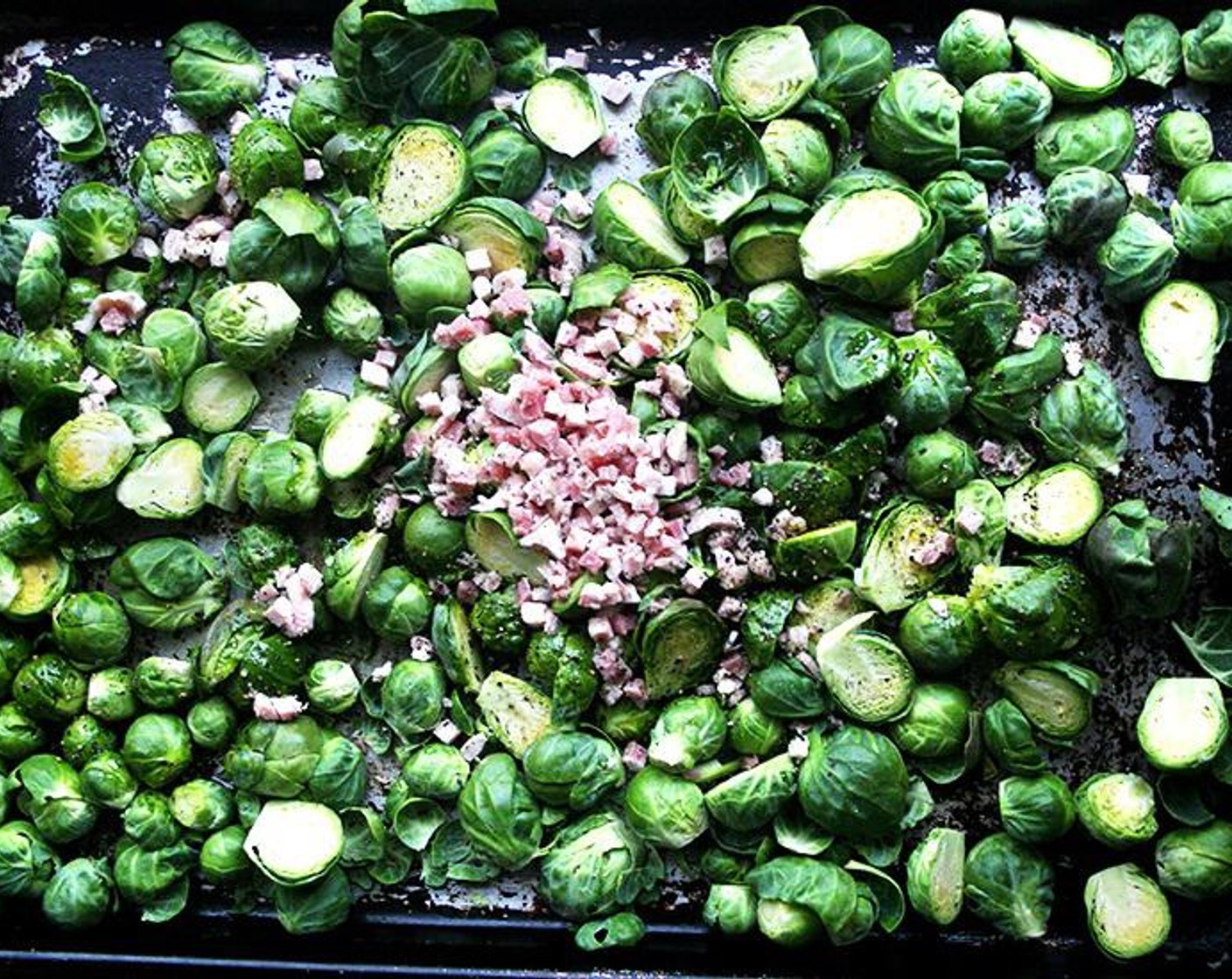 step 2 Place the Brussels Sprouts (5 cups) on a baking sheet, including any of the loose leaves. Cut the Pancetta (1/2 cup) into 1/2-inch dices and add to the pan. Add the Olive Oil (1/4 cup), the Kosher Salt (1/2 tsp) and Freshly Ground Black Pepper (1/2 tsp) and toss with your hands. Spread out the mixture in a single layer.