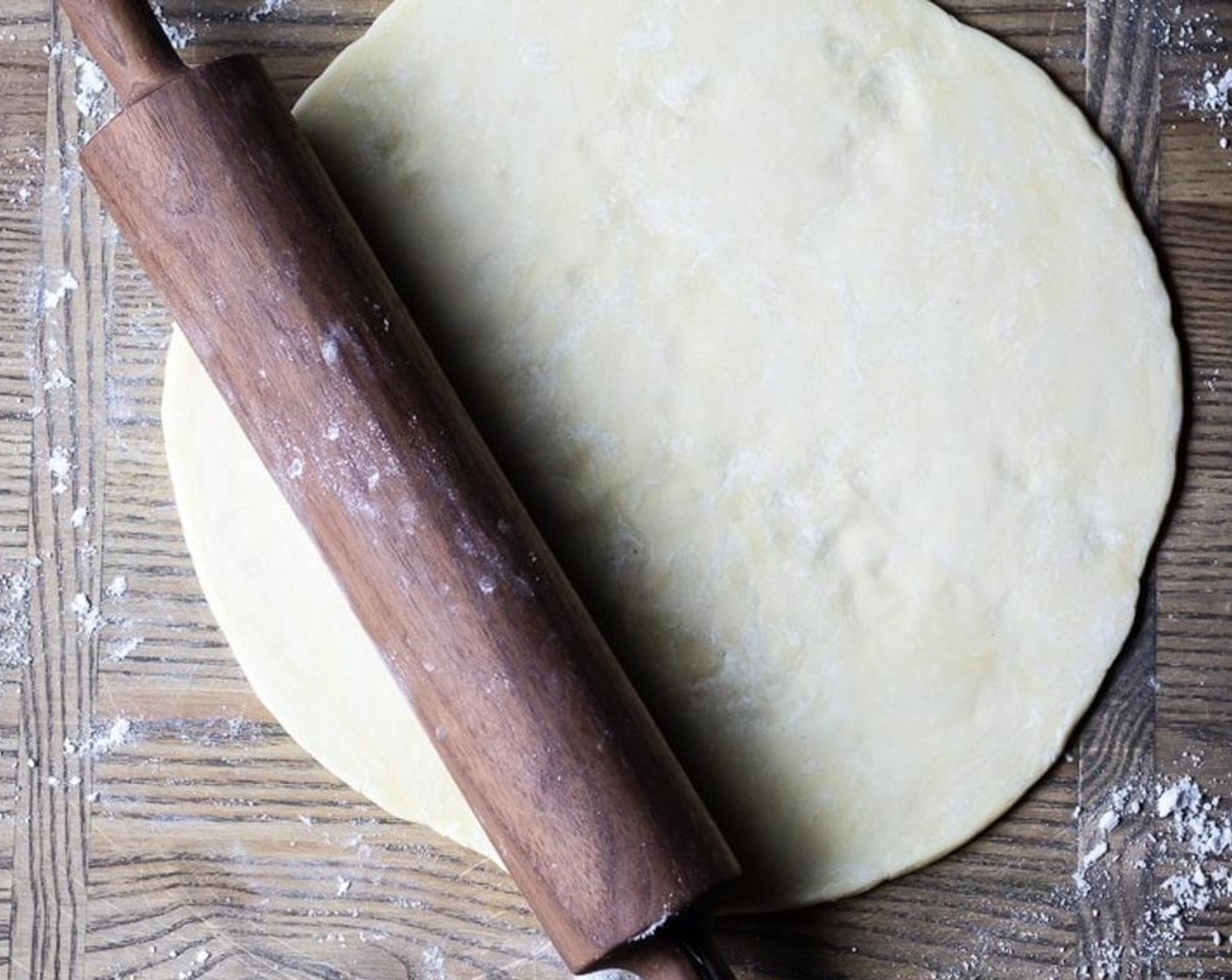 step 5 Roll your pie crust into a 12 inch round and slide pie crust onto a parchment paper lined baking sheet.