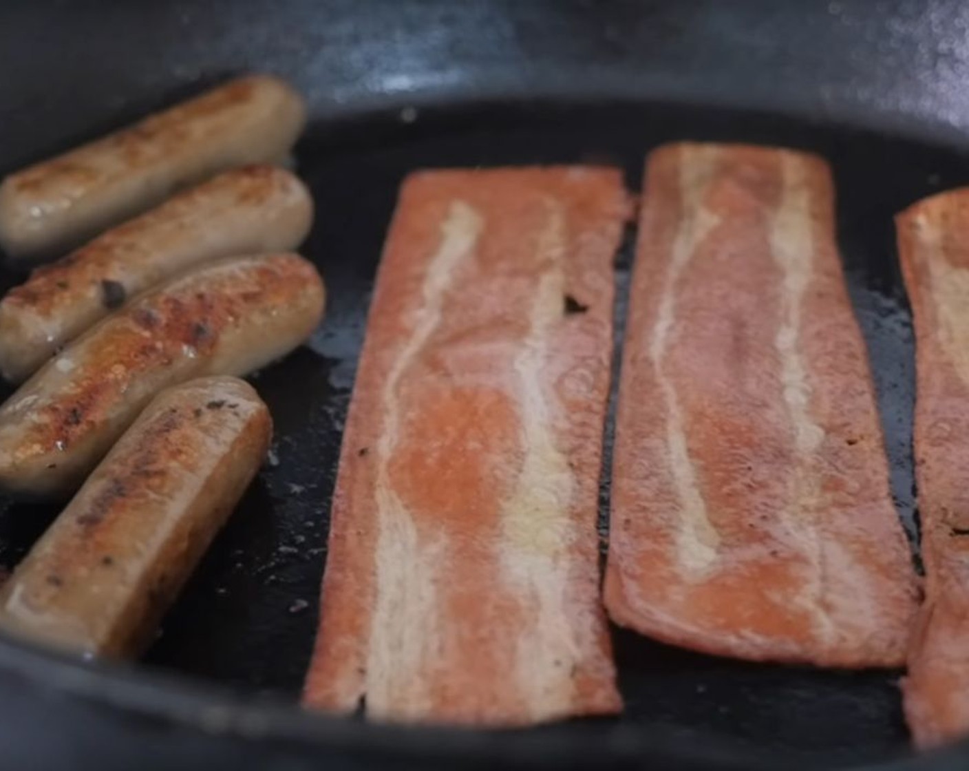 step 2 In a large pan, cook the Vegan Bacon (1 pckg) and Vegan Breakfast Sausage (1 pckg) according to the package directions. Set aside.