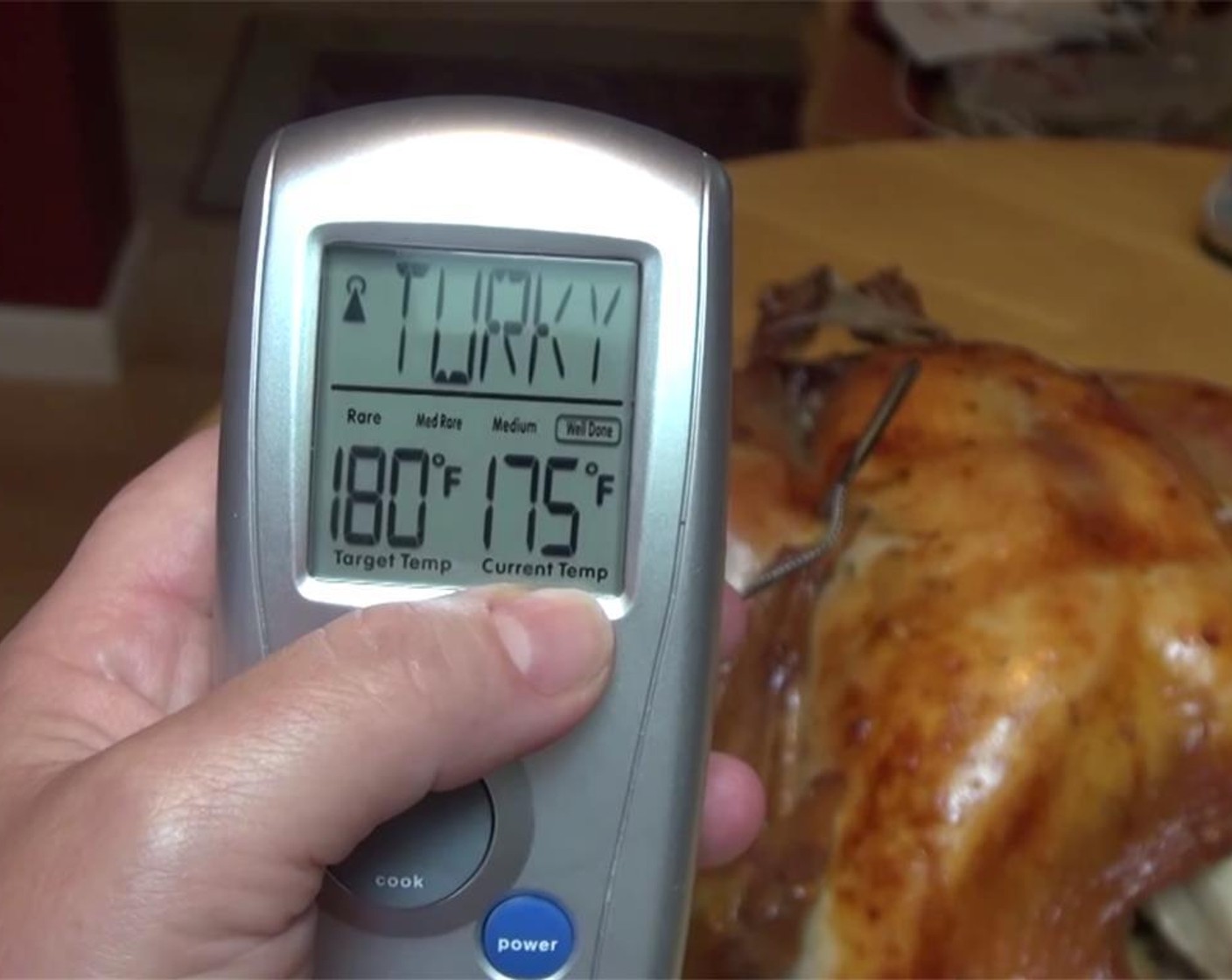 step 15 Remove the pan from the oven one more time, and insert a meat thermometer in the thigh area, close to the bone. Check to see if the internal temperature is 170 degrees F (75 degrees C). Brush turkey with butter, and roast, uncovered for 30 more minutes.