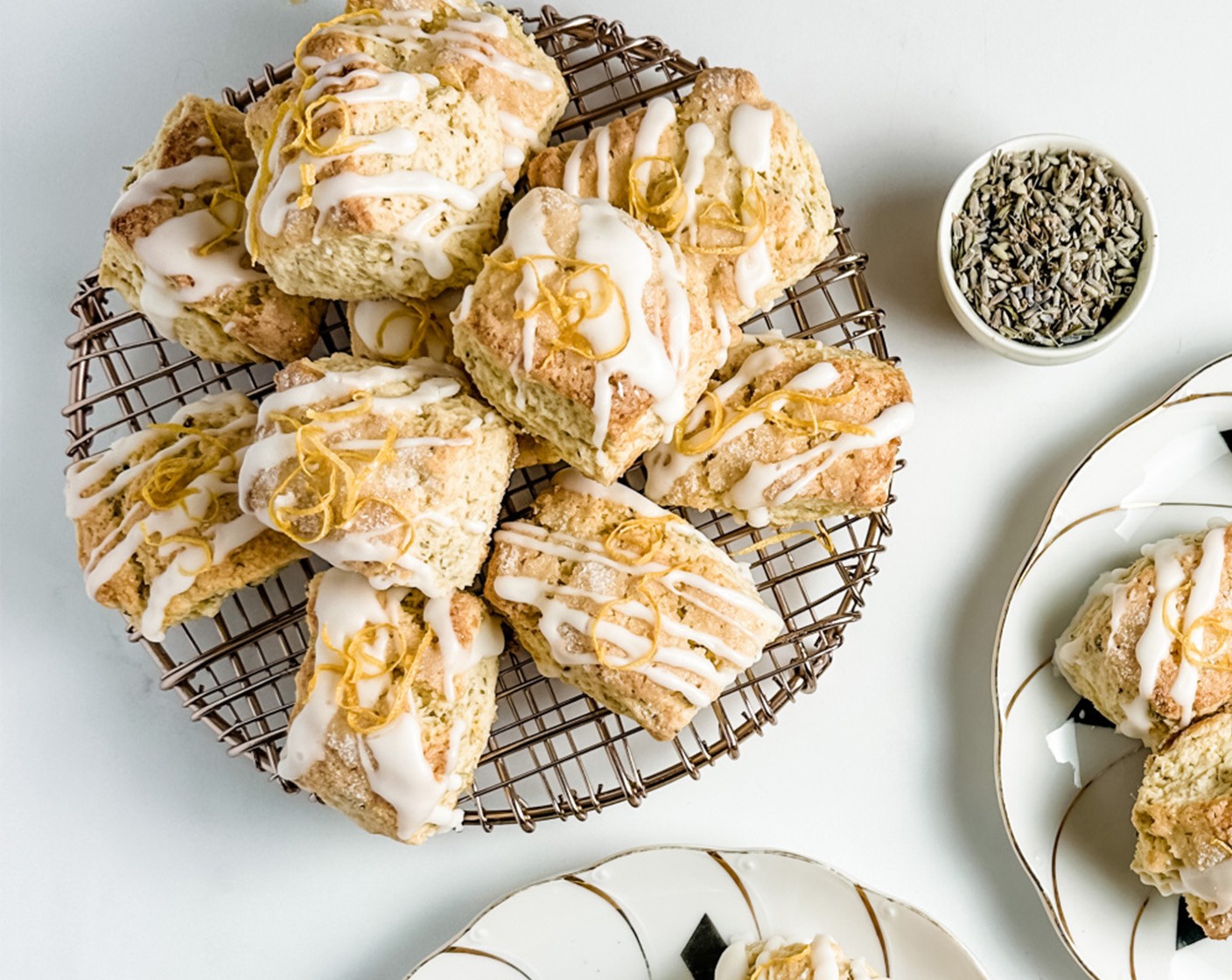 step 6 Place the cooled scones, still on the wire rack, on a piece of wax or parchment paper. Whisk the Powdered Confectioners Sugar (1 cup) with the remaining 3 tablespoons of Lemon Juice and drizzle over the cooled scones. Garnish with lemon zest if desired and let set before serving.