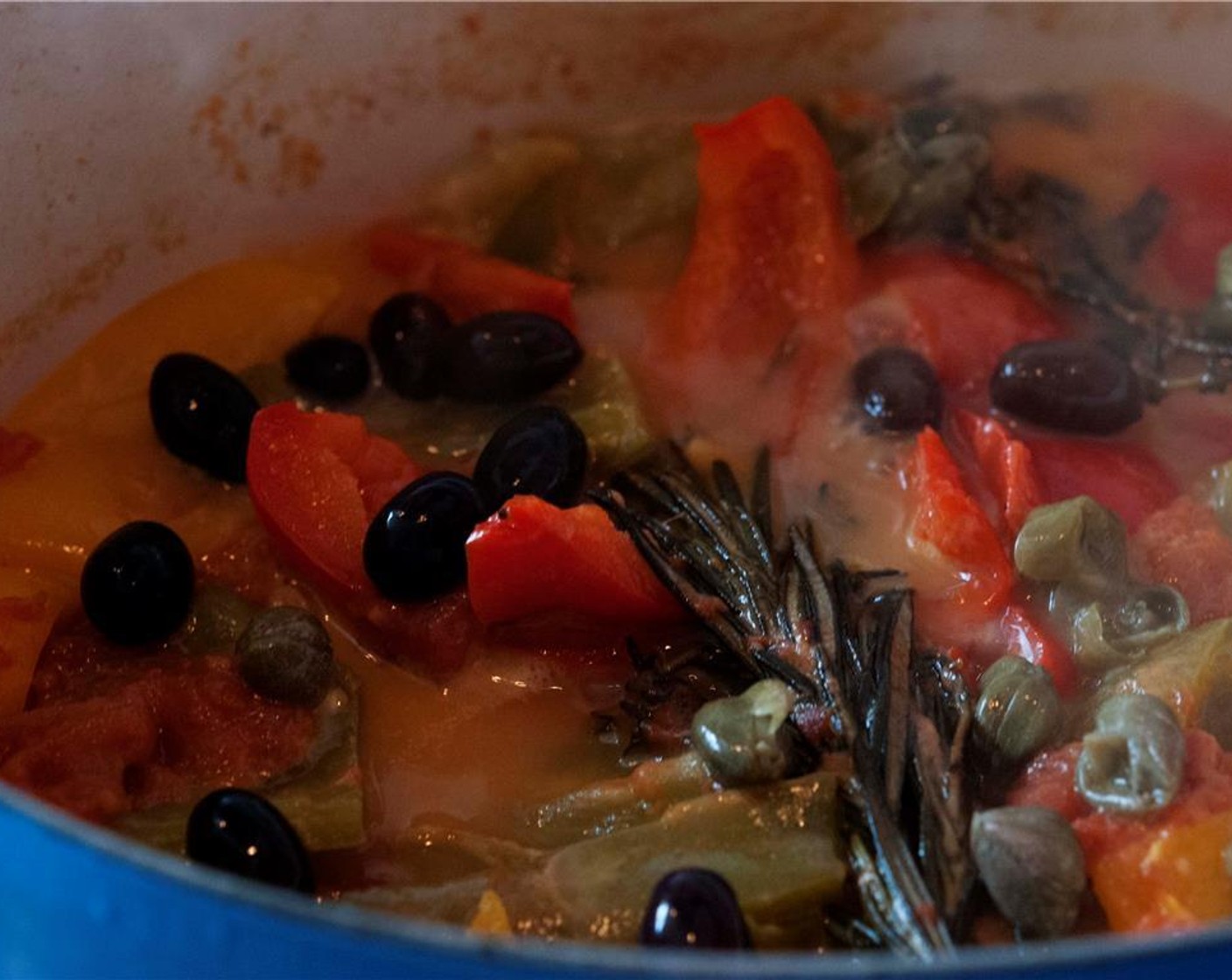 step 11 Remove the lid, add Black Olives (1/4 cup) and Capers (2 Tbsp), and keep cooking on low-medium heat until juice has reduced.