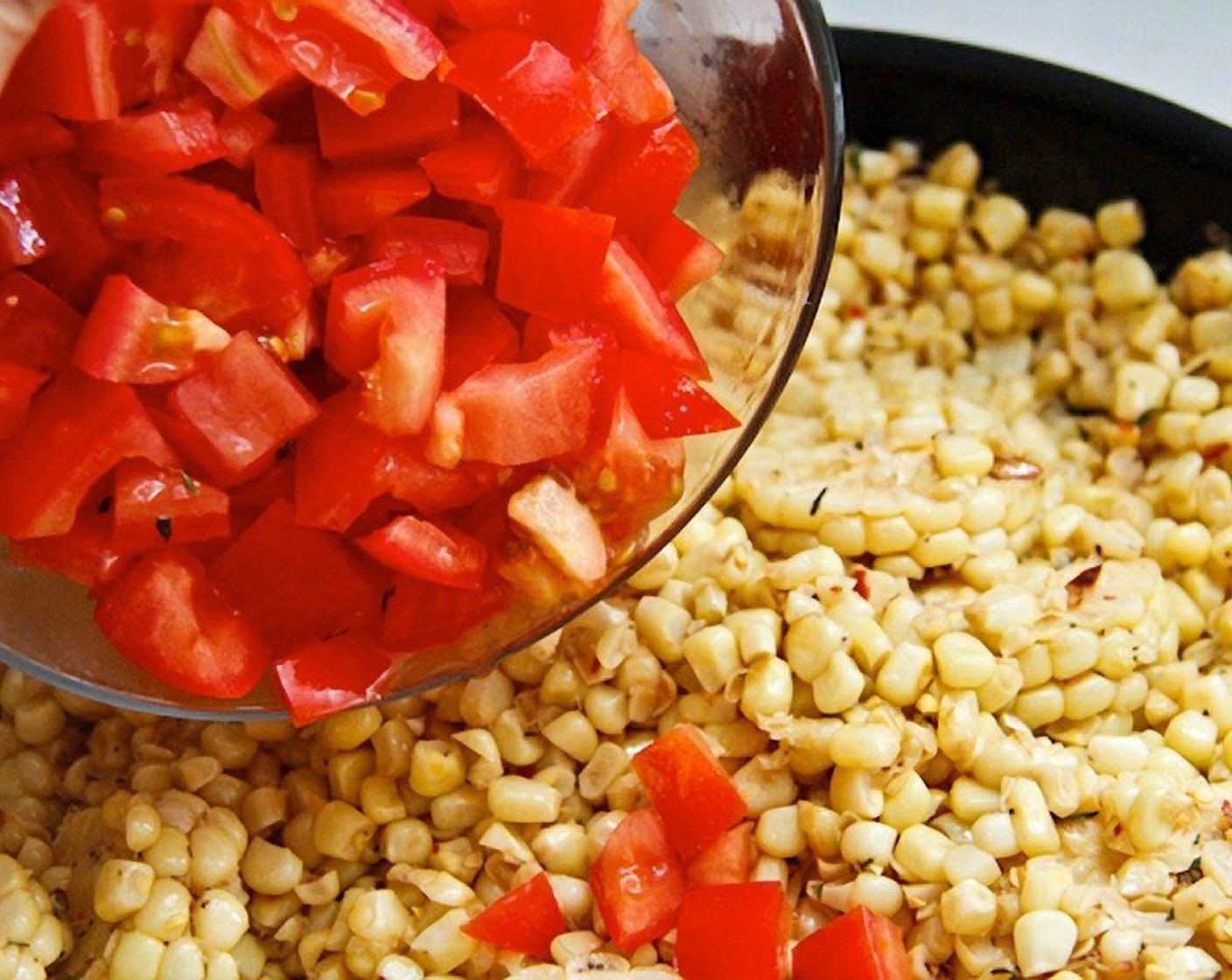 step 12 Turn the heat off, but keep the pan on the hot burner. Fold in the diced tomatoes and let the heat of the pan soften the tomatoes slightly. Taste and adjust the seasonings with extra salt if needed.