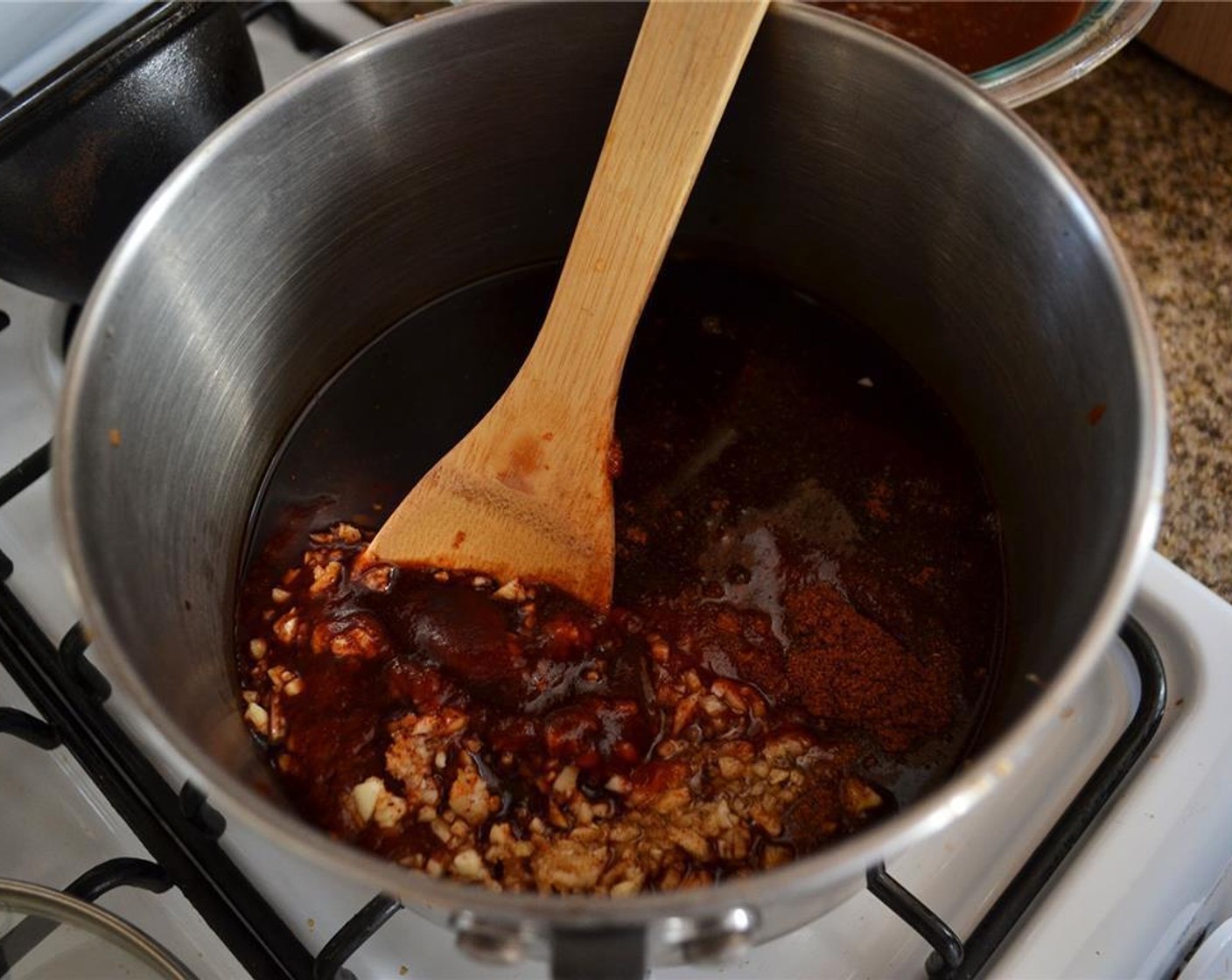 step 2 Combine Ketchup (2 cups), Balsamic Vinegar (1/2 cup), Cane Syrup (1/4 cup), juice from Lemon (1), Garlic (1/4 clove), Soy Sauce (1 Tbsp), Worcestershire Sauce (1/4 cup), Creole Seasoning (1/2 Tbsp), and Cayenne Pepper (1/2 Tbsp) in a 2 quart saucepan.