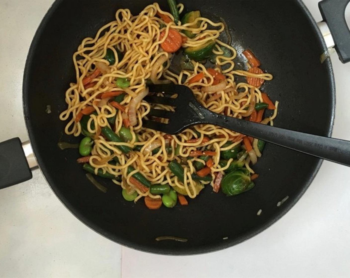 step 5 Stir fry the vegetables and noodles for 3 minutes. Then check the seasoning and add extra pepper, oyster sauce, fish sauce, soy sauce or sesame oil to taste if necessary.