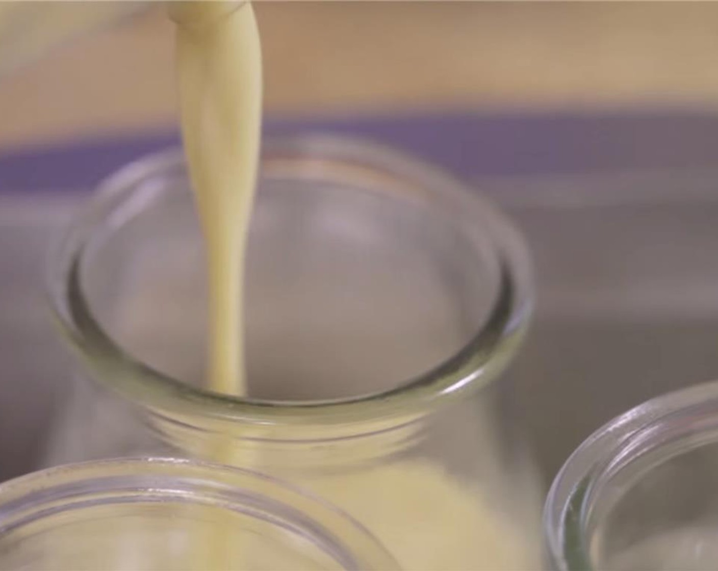 step 6 Pour the vanilla creme equally into individual serving glass or ceramic cups, filling about half way.