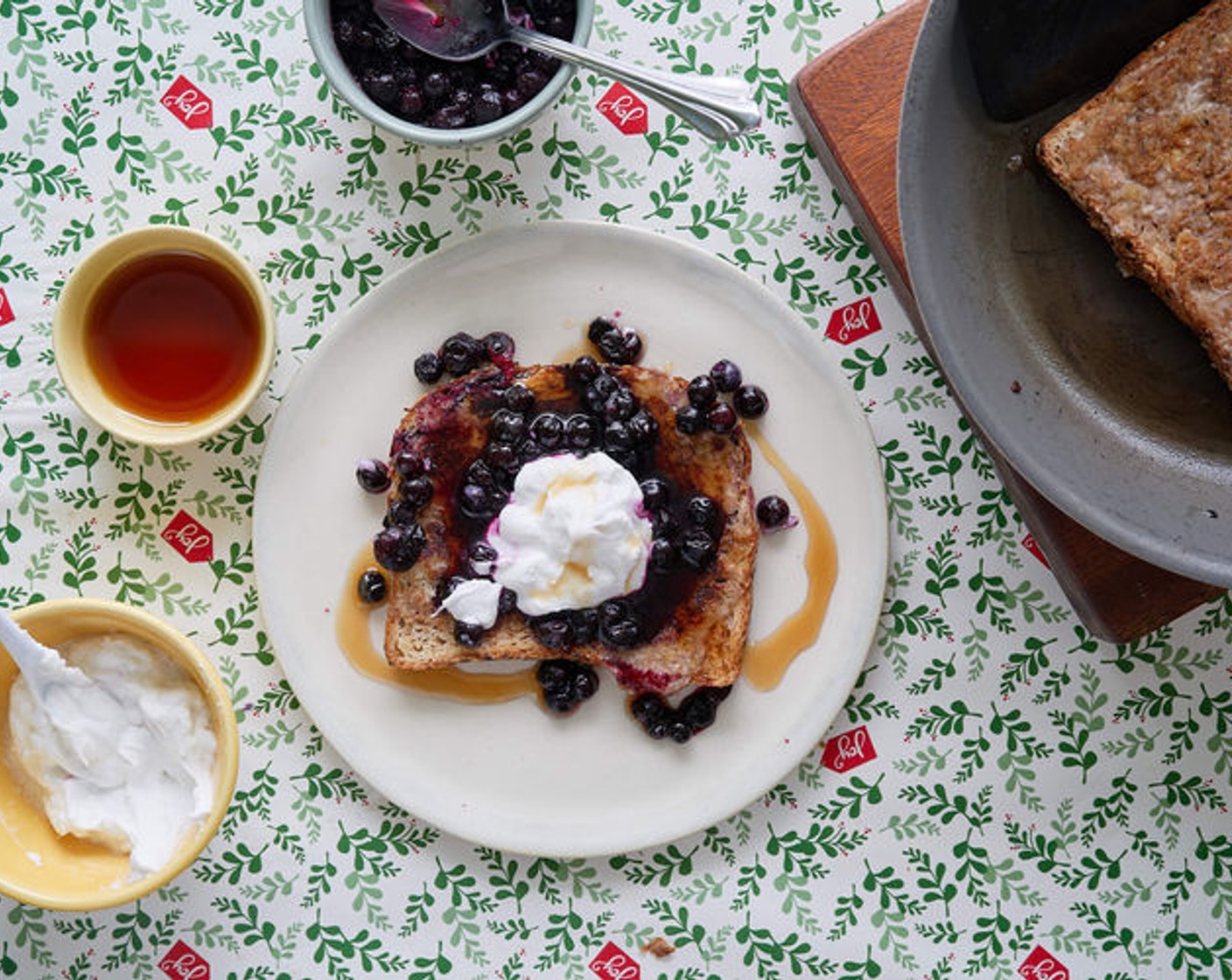 step 7 To serve, place 1-2 slices of French toast per person with a dollop of Yogurt (to taste), a spoonful of warmed wild blueberries, and a drizzle of Maple Syrup (to taste). Enjoy!