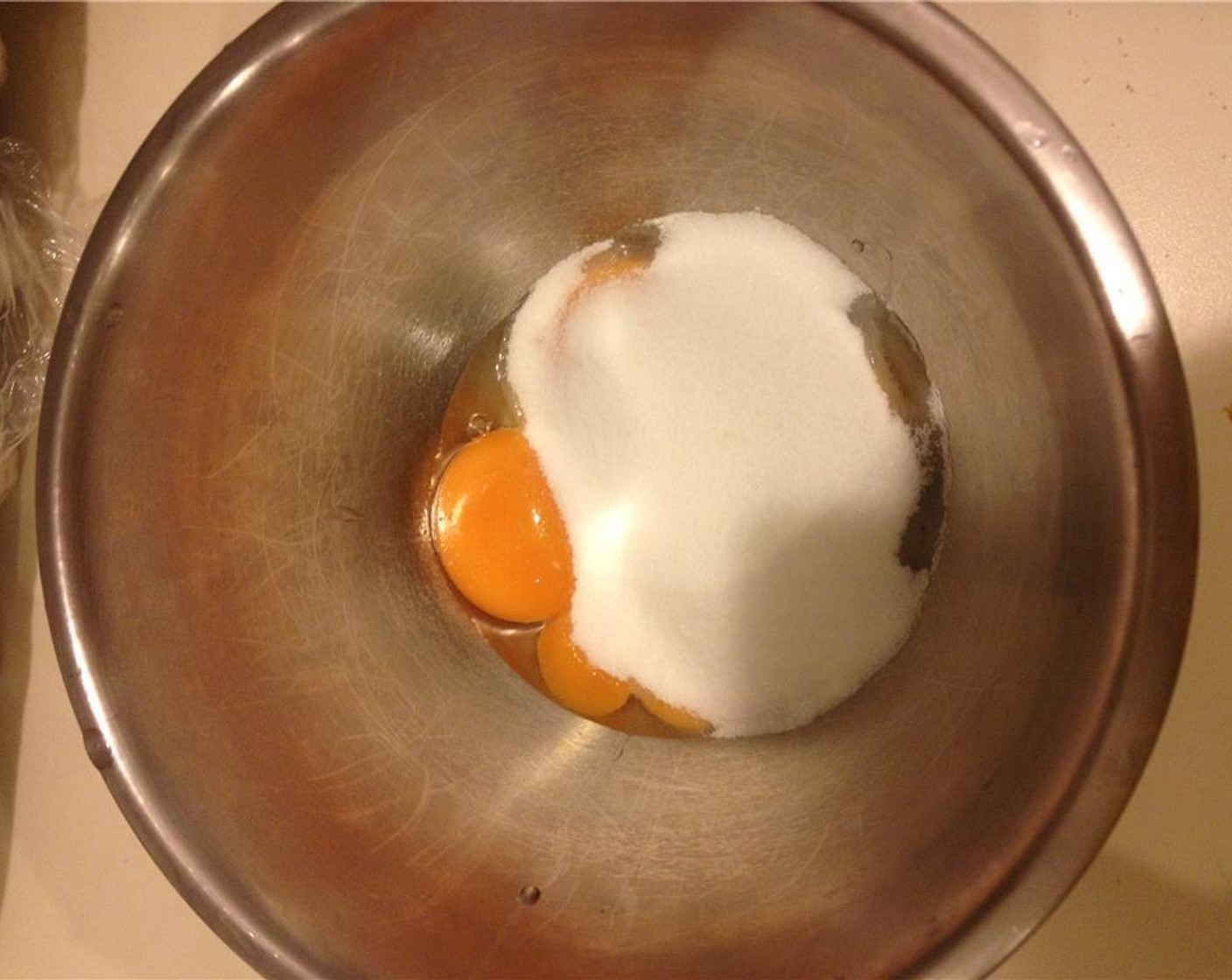 step 6 Meanwhile, sift the Corn Flour (3 Tbsp) together with Granulated Sugar (4 Tbsp) and mix in the 3 egg yolks until combined.