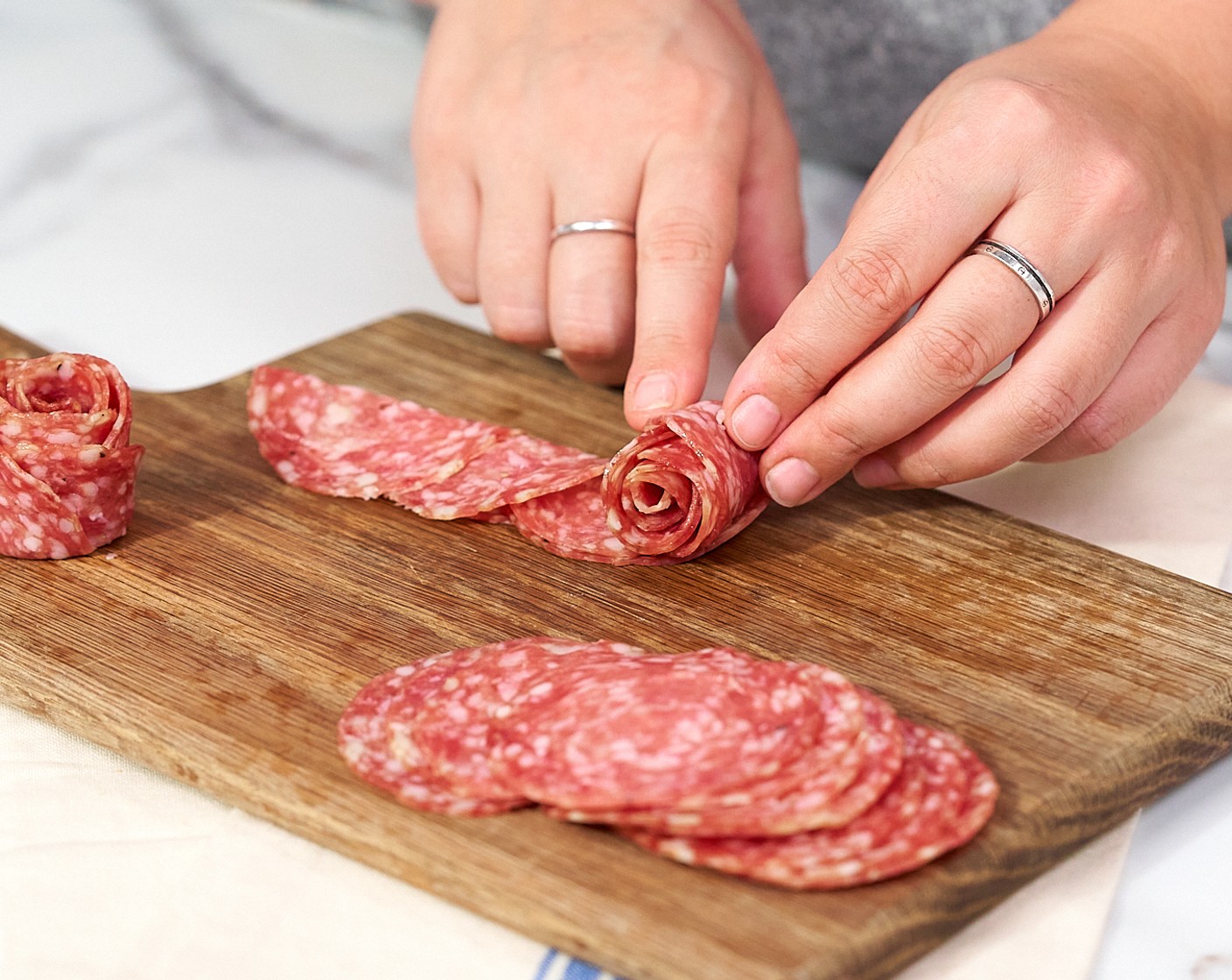 step 8 Once you’ve layered 5-6 pieces, roll them up and set them aside. Repeat with remaining salami.