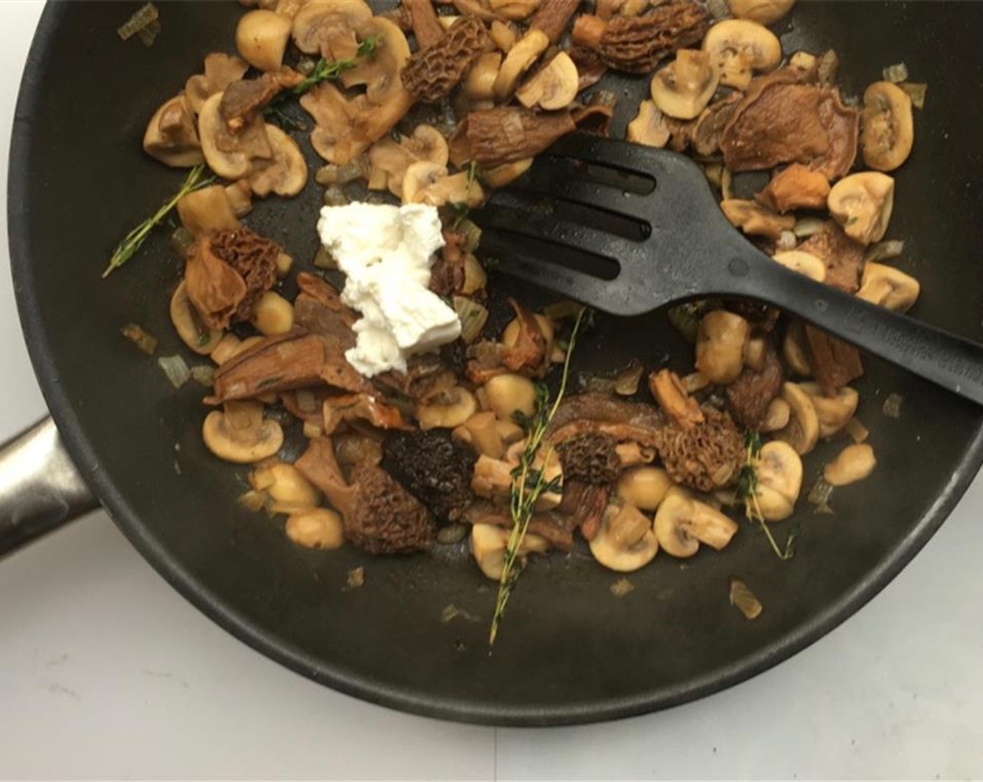 step 5 Stir well again and put a lid on the pan. Let the mushrooms simmer and cook in the liquid for 6 to 8 minutes. Then add the Ricotta Cheese (2 Tbsp).