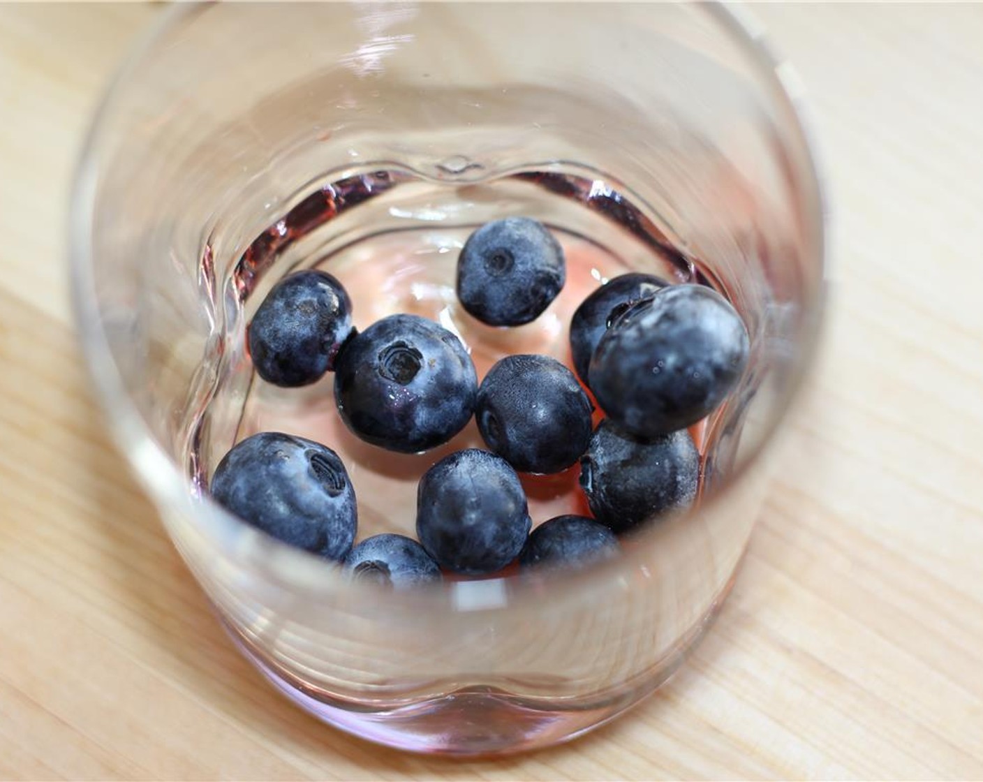 step 2 Add Peychaud's Bitters (2 dashes) and Fresh Blueberries (10) to a low ball glass.