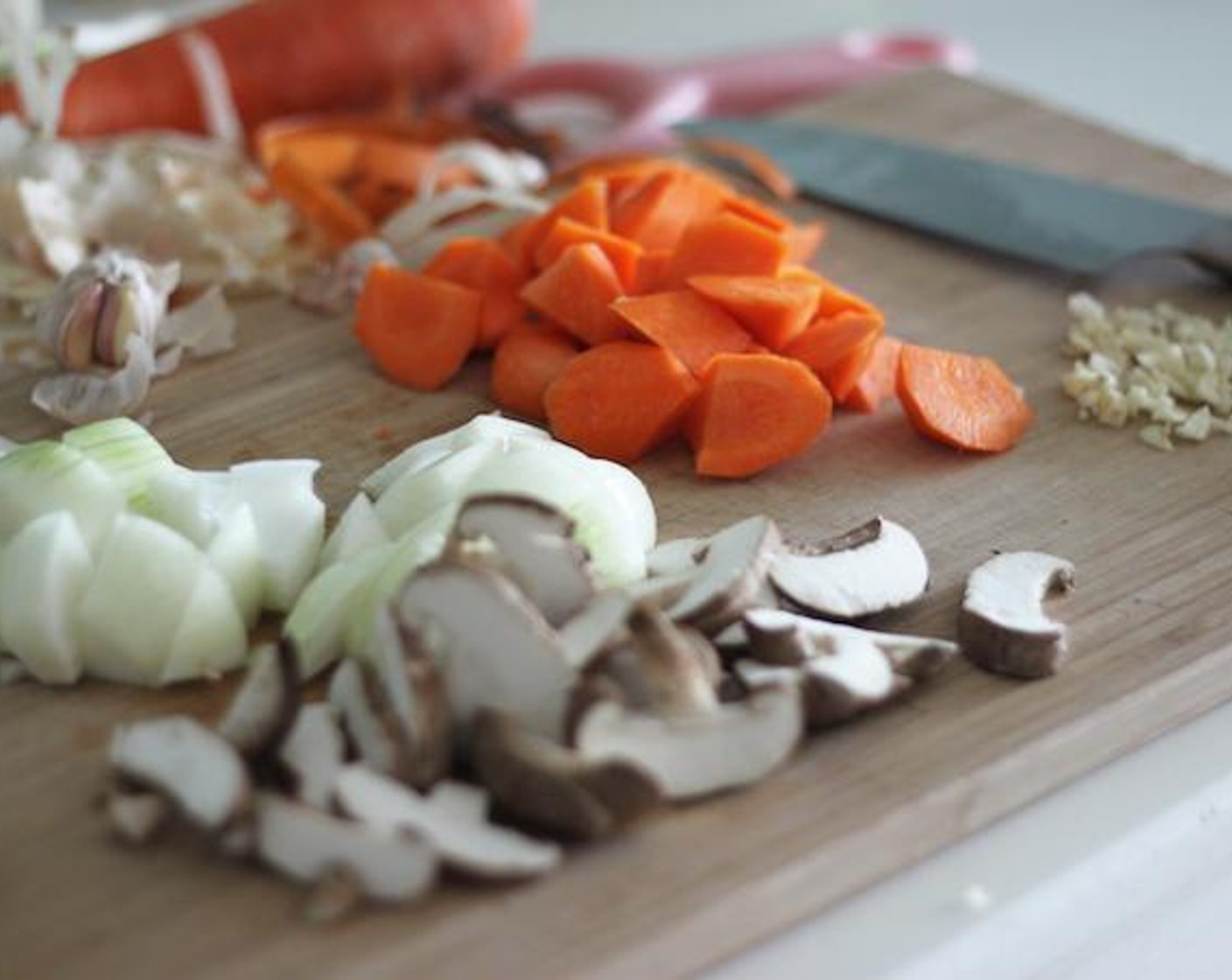 step 2 Chop Carrot (1), Onion (1), Mushrooms (3), and Garlic (3 cloves).