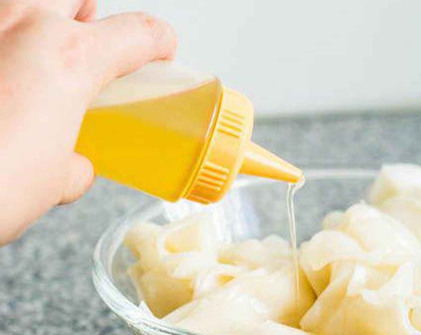 step 2 Pour Cooking Oil (1 Tbsp) over the noodles (fresh or previously dried). Toss the noodles with your fingers to coat them in the oil.