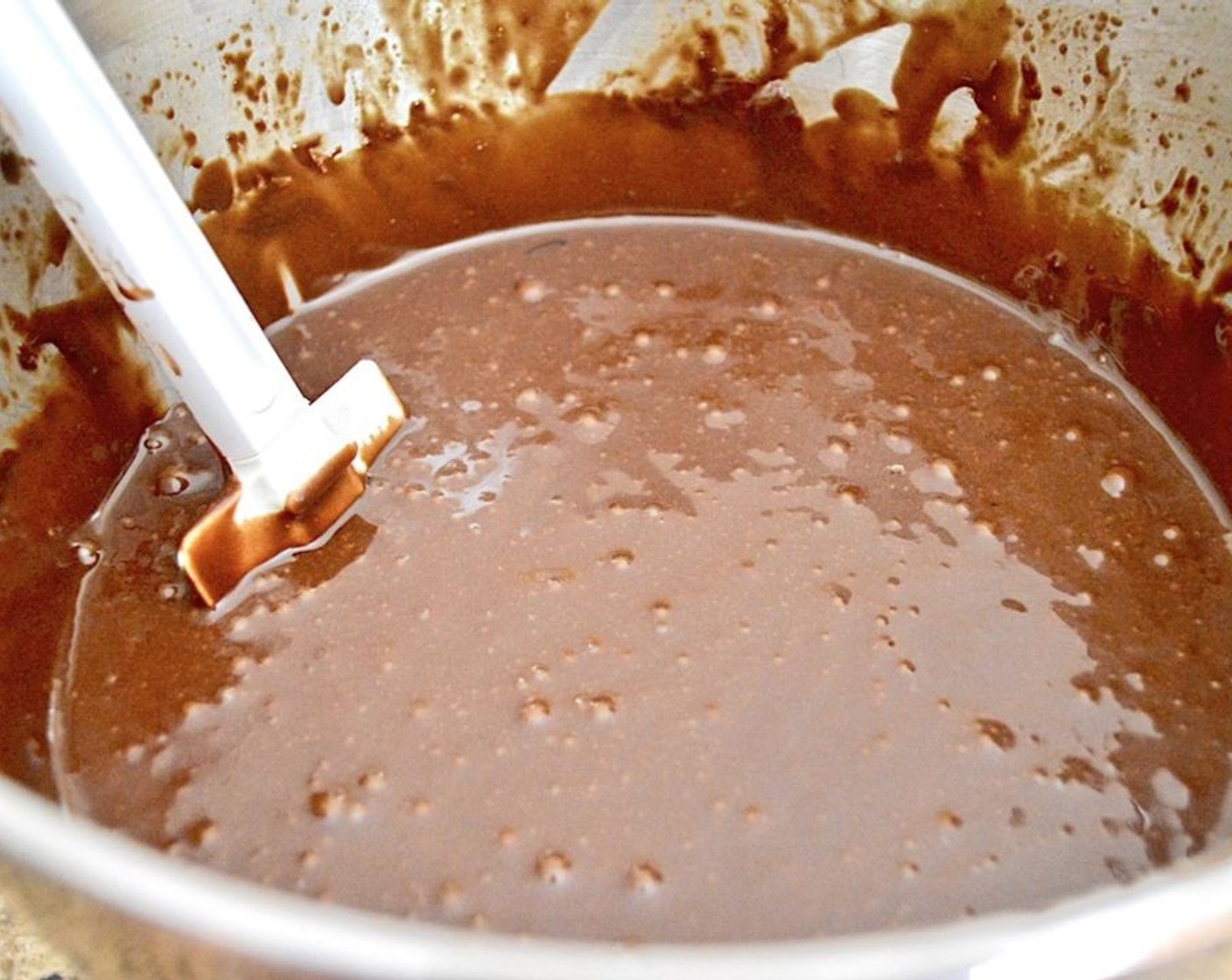 step 3 Slowly pour in the Milk (1 cup) and Vegetable Oil (1/2 cup), followed by the Eggland's Best Classic Eggs (2) and Chocolate Liqueur (2 tsp). Very slowly and carefully pour in the Water (1 cup) with the mixer on low.
