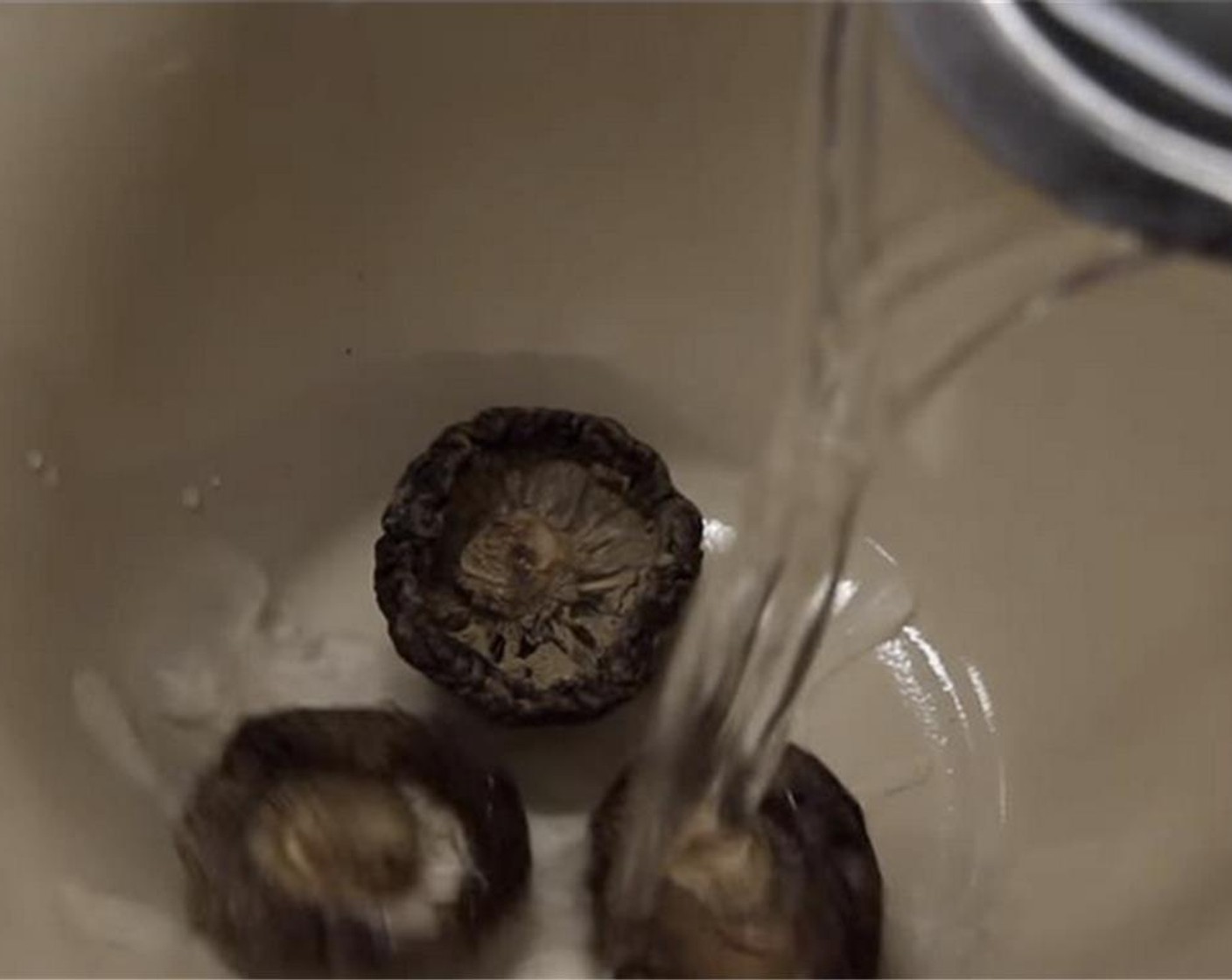 step 1 Soak the Dried Shiitake Mushrooms (3) in lukewarm water.