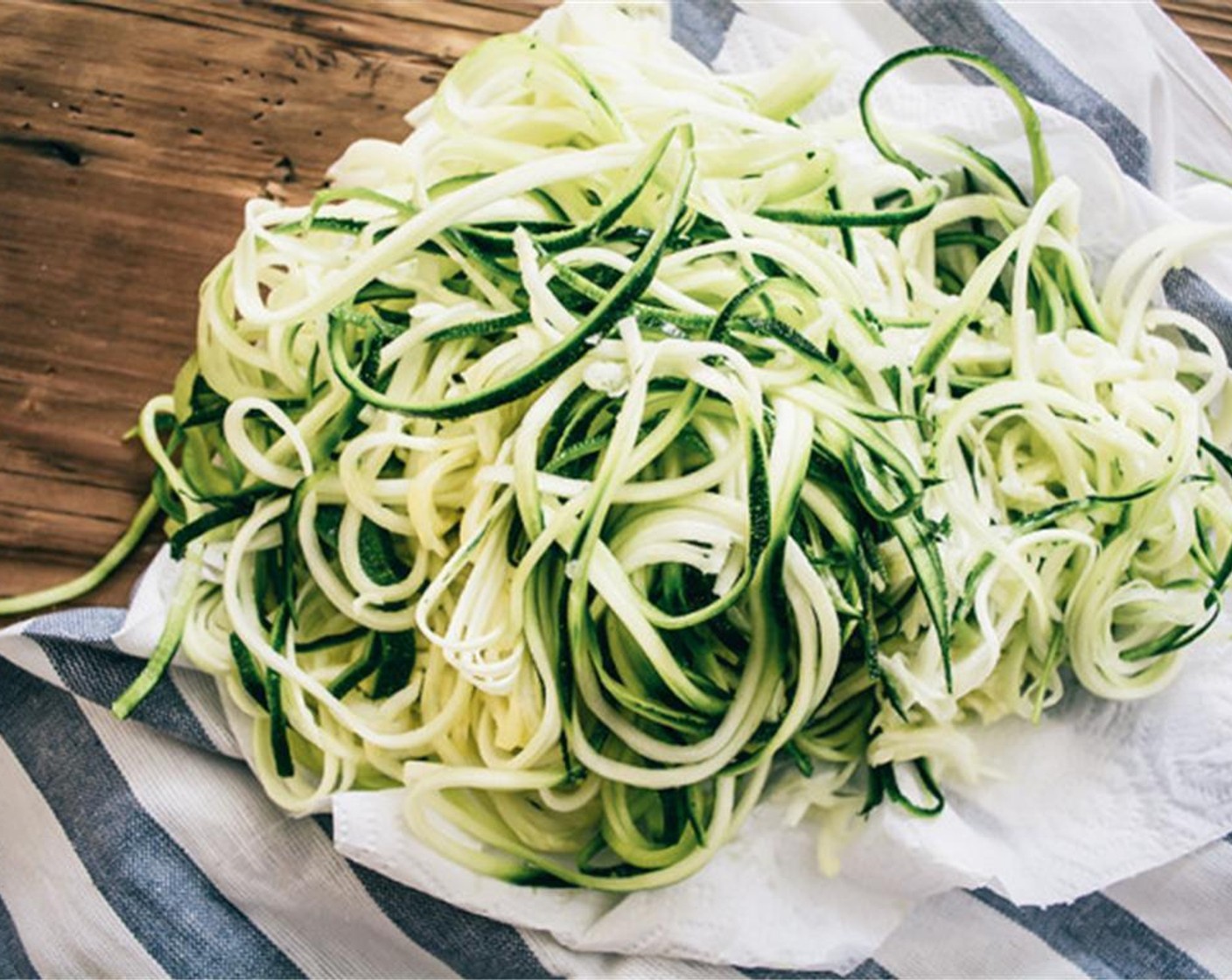 step 6 Add spiralized zucchini to medium pan and cook over medium low heat, continuously stirring. It doesn't take much to heat and cook the pasta, 3 to 5 minutes.