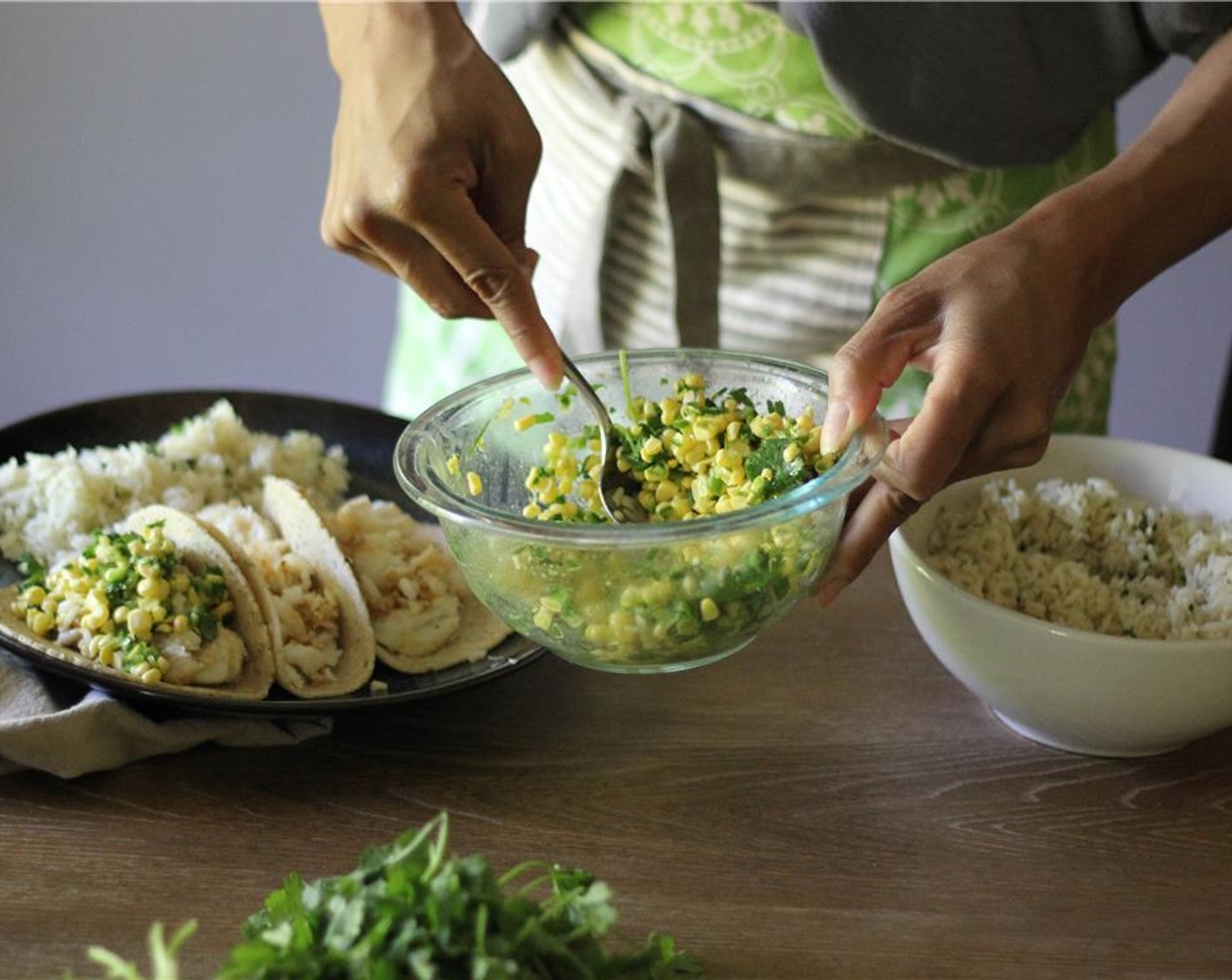step 8 To assemble tacos, place a few pieces of the flaked fish into a warmed Tortillas (4), top with spoon full corn ceviche and extra cilantro if desired.