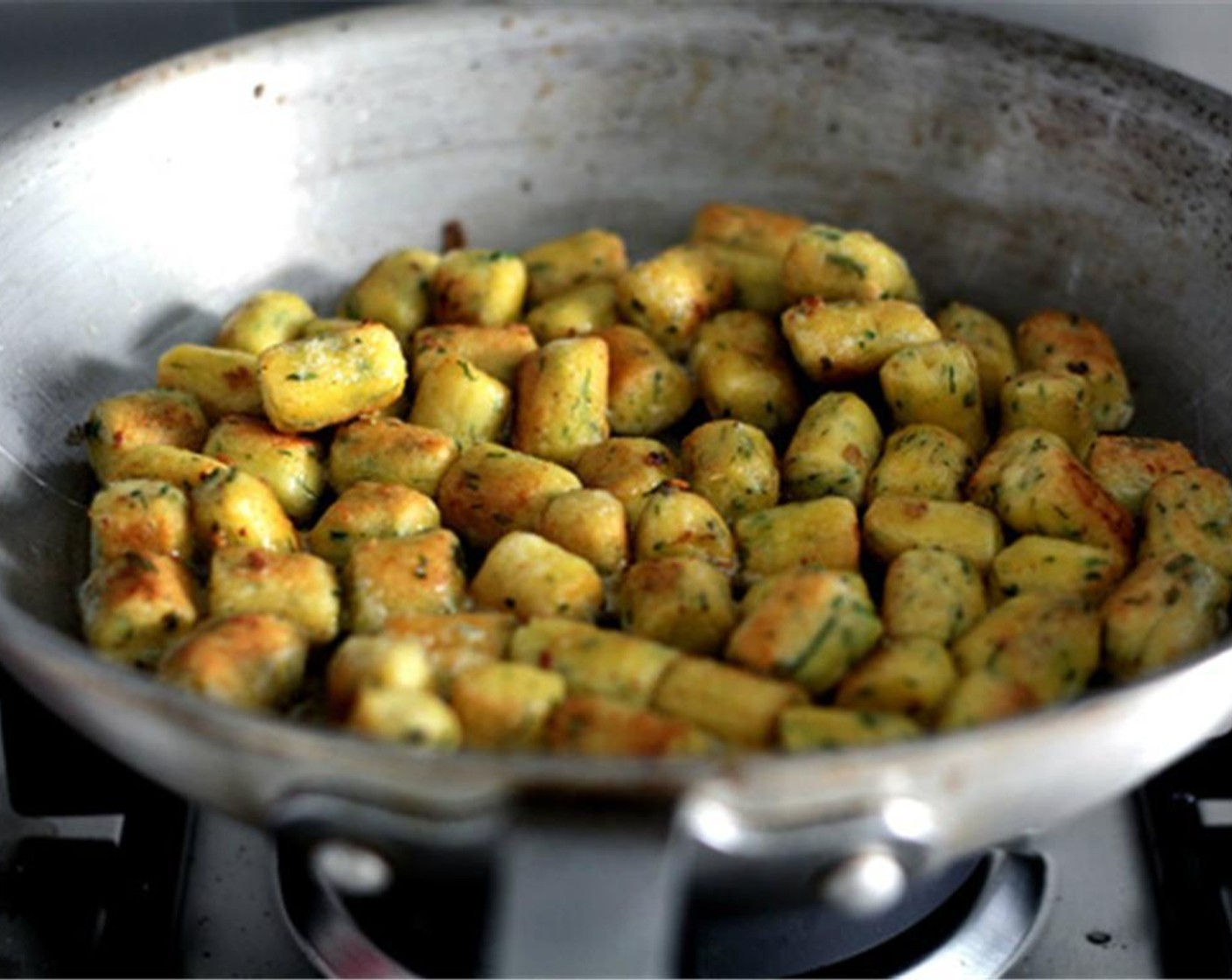 step 16 Heat up a large, flat skillet over medium-high heat (use non-stick if in doubt), then add the Unsalted Butter (1 Tbsp). Once it starts to brown slightly, add the gnocchi and pan-toast them until nicely browned on both sides. Transfer to a plate.