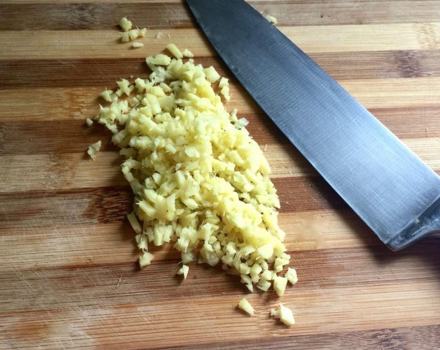 step 3 Then, wash and skin a piece of Fresh Ginger (4 slices). Mince into small pieces.